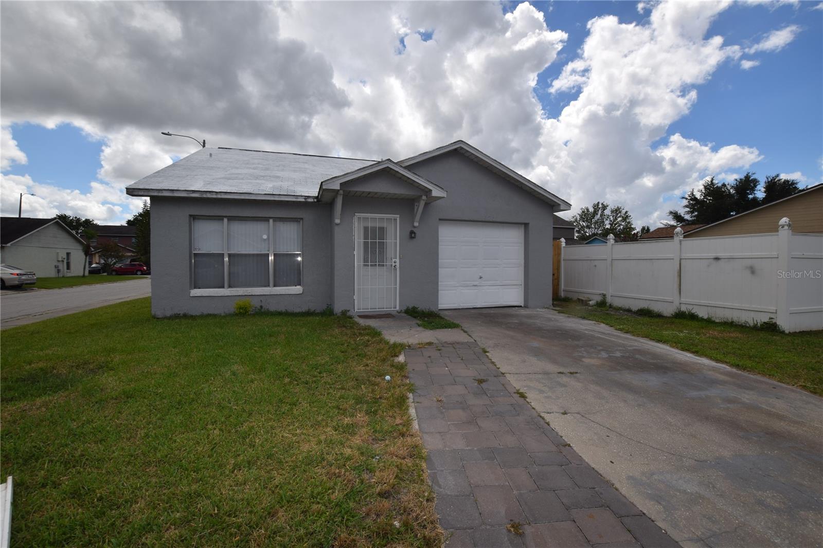 3 Bedroom 2 Bath Single Family Home For Rent in Orlando, FL 32808; Central Heat & Air, Range, Refrigerator, Dishwasher and Disposal, One Car Garage.
