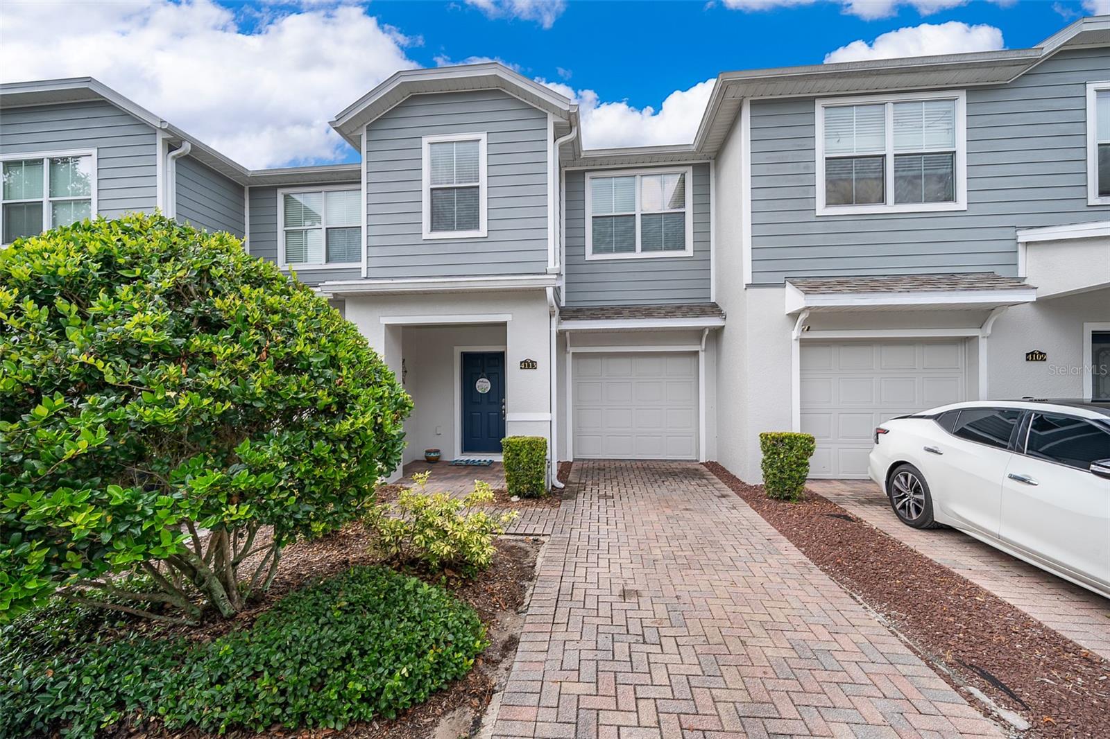 If you are looking for a Gated Community with the most desirable location in the community you know you have found it! This home boosts an open floorplan that includes a breakfast bar and open to the family and dining area on the main floor, with high ceilings and lots of natural light. Upgraded appliances, kitchen countertops, and flooring. This floor plan offers two spacious master suites upstairs both with walk in closets, divided by a large laundry room complete with storage and large washer and dryer that are staying! No more carrying laundry up the stairs. Beautiful hardwood floors including the stairs with well-appointed finishes throughout. A MUST SEE! Conveniently located near UCF, shopping, roadways, restaurants and the TOP RATED SCHOOLS in the area.