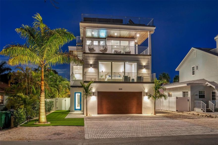 Welcome to your dream beach oasis nestled on quiet Elm Ave just 7 houses away from the pristine Gulf of Mexico beaches and one block away from Pine Avenue!!  This stunning BRAND NEW construction is meticulously crafted with attention to detail and quality finishes throughout.  With 4 large balconies AND a roof top, you will never want to leave!  Boasting a spacious layout with four bedrooms and five and a half bathrooms, this immaculate home you are immediately greeted by an ambiance of elegance and comfort, blending seamlessly with the coastal charm of Anna Maria Island.  The open floor plan is designed for both relaxation and entertainment, featuring living/dining/kitchen that flows effortlessly and includes many outdoor balconies for that indoor/outdoor feel.  Prepare culinary delights in the chef's kitchen, equipped with stainless steel appliances, sleek quartz  countertops, and ample storage space.  The primary bedroom has luxurious finishes including light fixtures and an ensuite bathroom and 2 closets. The front balcony off the primary bedroom has gulf views, perfect to have your morning coffee and a gulf breeze.  The 4 additional well-appointed bedrooms offer comfort and privacy for family and guests, each thoughtfully designed with modern conveniences and stylish touches. Lounge on either the upper or lower spacious back patios, views of the pool and soak up the sun.  The most amazing part is the rooftop deck that has breathtaking panoramic views of the Gulf, providing the perfect backdrop for sunset cocktails or stargazing under the night sky.  Take a refreshing dip in the heated pool, surrounded by lush landscaping and tropical foliage and enjoy the turf with put put golf!   Enjoy the covered area so you don’t get too much of the hot Florida sun and play ping pong or hang by the outdoor bar with a TV!  Located in the heart of Anna Maria Island, this exceptional property offers the ultimate coastal lifestyle, with the nearby Gulf beaches, charming boutiques and restaurants on Pine Ave, its the best of both worlds!  Whether you're seeking a year-round residence or a luxurious vacation rental investment, this presents a rare opportunity to experience the best of island living in one of Florida's most desirable destinations.  Don't miss your chance to own a piece of paradise – schedule your private showing today and discover all that this magnificent home has to offer!