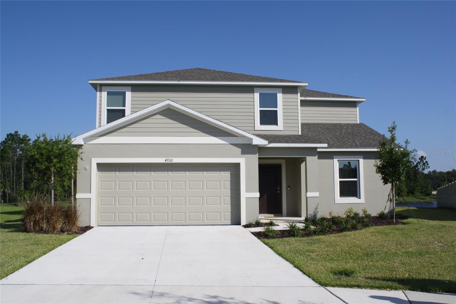 The property features a large great room that transitions directly into an open-plan kitchen with casual dining space. This space leads to a downstairs bedroom with adjacent bath on the other. A fun option for overnight guests. On the second floor, the primary suite and three additional bedrooms are conveniently located next to the laundry room and hallway linen closet. The primary suite features a long rectangular walk-in closet, dual sinks and vanities, oversized shower enclosure, private WC and linen closet. Two of the three secondary bedrooms offer walk-in closets and all three share a creative bathroom arrangement with dual sinks and vanities separated from the toilet and shower with an interior door. The downstairs space is complete with a charming study with double doors, perfect for setting up a convenient work from home office.