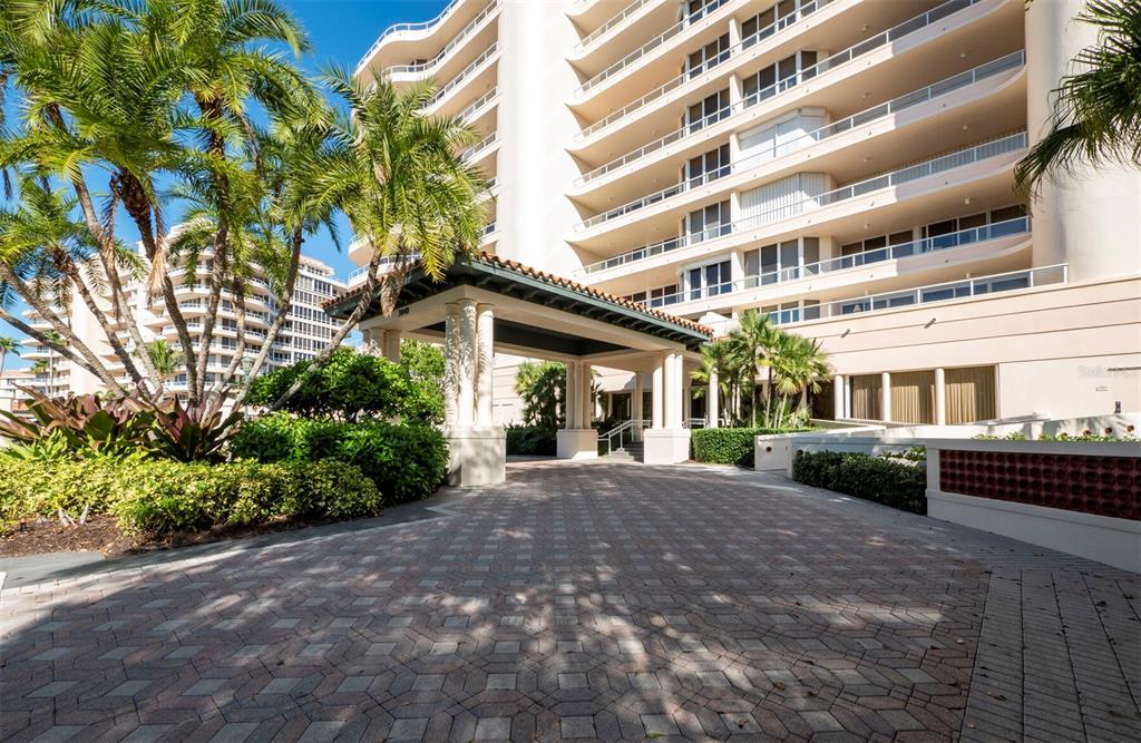 Remarkable style meets a breathtaking panorama and world-class conveniences in this beautifully remodeled 2BR/2.5BA, 2,550+/- sq.-ft. residence in Grand Bay on Longboat Key. Beginning with its coveted, rarely found 2 covered parking spaces, a private elevator takes you directly to the foyer and double glass door entryway of this spectacular showplace. Immediately behold the painstakingly and professionally crafted interior by a celebrated designer, who has created a modern-chic living space that meticulously mingles distinct details with astounding appointments to complement its spectacular backdrop beyond. The Cayman floor plan has earned its place as a resident favorite in this esteemed community, offering a full-floor vantage that affords views of the Gulf of Mexico and its spectacular sunsets on one side and the shimmering bay, Harbourside Golf Course and vibrant lights of downtown Sarasota on the other, with terraces on each. Entertain on any scale with ease in this open, flowing layout, where the living room with its entertainment wall built-in adjoins the dining area and the sleek, contemporary kitchen, with low-profile cabinetry, stainless steel appliances, tile backsplash and eat-in area with a wall of sliders. The bedroom accommodations are also fabulous and spacious, with the master suite boasting a full wall of glass, sitting area, and master bath with separate vanities, a walk-in shower and a spa tub. Living in Grand Bay comes with a full menu of features, including a designer-decorated lobby, clubhouse, two community pools and spas, a large fitness center with saunas, and Har-Tru tennis courts. Residents also have the pleasure of all the benefits of Bay Isles, with miles of walking paths and membership to the private Bay Isles Beach Club.