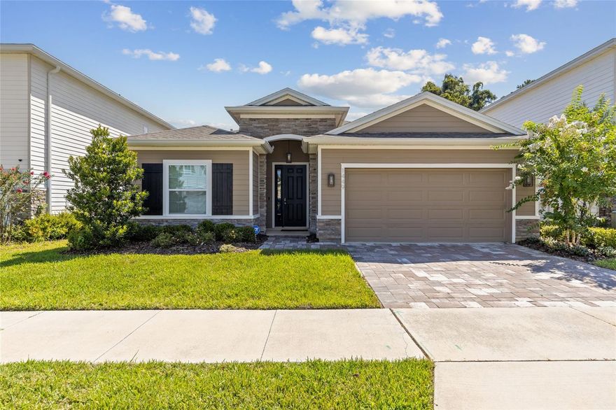Now is the perfect time to make your move! Step inside this beautifully appointed home in Arbor Greens and discover a space that blends comfort, style, and upgrades you won’t find in today’s new construction without paying extra. The welcoming foyer opens to wide, light-filled living space accented by wood-look tile floors that flow through the main areas, while brand-new carpet adds warmth and comfort in each of the bedrooms. The heart of the home is the open kitchen and family room, perfect for gathering and entertaining. Granite countertops, modern cabinetry, and a spacious island make cooking a pleasure, while the living area invites you to relax and enjoy the view of the private backyard. A screened lanai creates the ideal outdoor retreat, overlooking the fully fenced yard that’s ready for play, pets, or peaceful evenings. The private owner’s suite is a retreat of its own, featuring dual vanities with granite counters, a garden tub, a separate walk-in shower, and two walk-in closets. Three additional bedrooms share a well-designed layout with plenty of natural light, along with a convenient half bath for guests. Unlike new construction nearby, this home comes ready with thoughtful upgrades already in place, including gutters, garage storage, a Tesla charger, and a full smart-home system with Nest thermostat, video doorbell, smart lock, and ADT security with cameras. The washer, dryer, and refrigerator are also included, saving you thousands compared to starting from scratch. Living in Arbor Greens means more than just a home—you’ll enjoy a community clubhouse, sparkling pool, playground, park, and HOA maintained front yard! All of this and within easy reach of Jonesville/Tioga Publix, shops, and restaurants, plus quick access to I-75, UF, and Santa Fe College. This like new move-in ready home combines the best of convenience, value, and lifestyle.