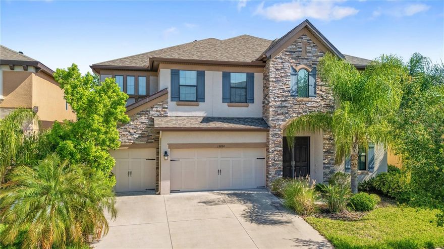 Welcome to this exceptional 5-bedroom (including 2 Primary Suites), 5-bathroom home with a 3-car garage located in the gated community of Reserve at South Fork. Offering an impressive amount of space and flexibility, this home is ideal for multigenerational living, large households, or those needing extra room for work and play. Step inside to a bright, open floor plan featuring soaring ceilings and abundant natural light. Downstairs you will find a gourmet kitchen complete with ample cabinetry, quartz counters, large island, huge walk-in pantry, and an eat-in dining area—perfect for both everyday living and entertaining. The kitchen overlooks the living room and there is a separate dining room. The office is also downstairs along with a bathroom and one of the Primary suites with a huge walk-in closet and en-suite bath with dual sinks. Upstairs you will find another primary suite which provides a private retreat with a balcony, large walk-in closet and an ensuite bath featuring dual sinks, a soaking tub, and a separate walk-in shower. 3 additional bedrooms are upstairs along with a loft, bonus room, and 3 additional bathrooms. Enjoy outdoor living in the fully fenced backyard, offering privacy and plenty of space for pets, play, or future outdoor enhancements. With five bedrooms plus additional rooms and spaces, there’s incredible versatility for guest suites, or hobby spaces. Located within a secure gated community, residents of South Fork enjoy amenities including a pool, playground, walking trails and much more!. Conveniently situated near shopping, dining, schools, and major highways, with an easy commute to Tampa and surrounding areas. Opportunities like this—combining size, location, and value—don’t come often. Schedule your private showing today!