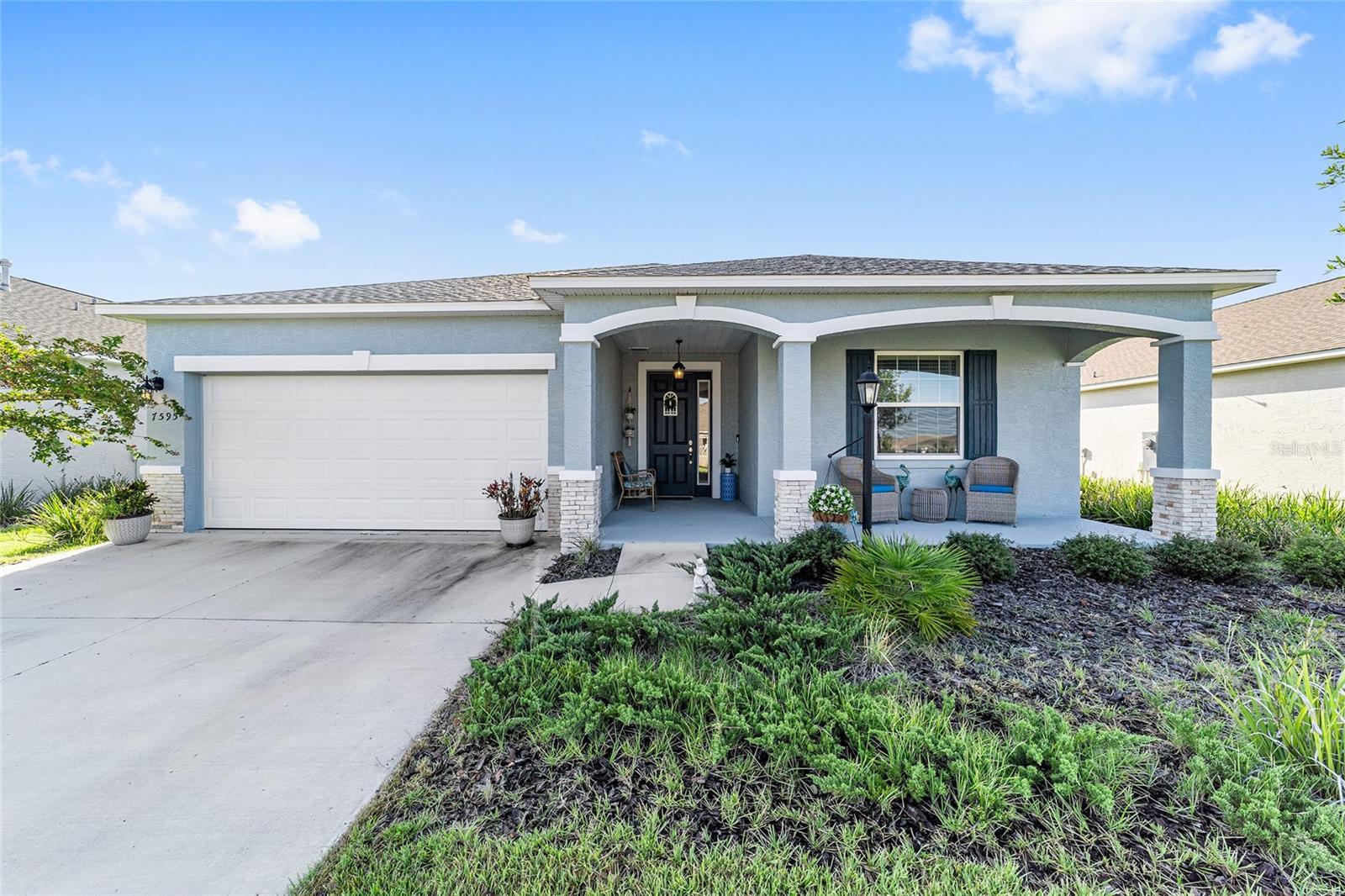 NO REAR NEIGHBORS IN WEYBOURNE LANDING! Why wait to build when you can move right into this beautifully appointed 2023 Ginger model smart home? Offering 2 bedrooms, 2 bathrooms, a versatile flex room (perfect as a den, office, or formal dining room), and a 2-car garage, this home is designed for modern living.
The open floor plan is ideal for entertaining, featuring a spacious kitchen with an oversized island, quartz countertops, tile backsplash, stainless steel appliances, under-cabinet lighting, upgraded cabinetry with pot drawers and pull-out waste bin, closet pantry, and crown molding. Luxury vinyl plank (LVP) flooring runs throughout the home for a seamless and stylish look.
The primary suite boasts a walk-in closet and a beautifully designed en suite bath with dual quartz vanities and a zero-entry walk-in shower. Enjoy quiet mornings or relaxing evenings on the screened lanai with no rear neighbors—your private outdoor retreat. Option to purchase mostly furnished – inquire for details.
Located in Weybourne Landing, a gated, fee-simple community within the On Top of the World campus, residents enjoy exclusive amenities such as a private clubhouse, swimming pool, pickleball courts, fitness center, and miniature golf. For a small additional fee, residents can also access the world-class amenities of On Top of the World—Ocala’s premier 55+ community—with golf cart access to shopping, dining, banking, and healthcare.
Don’t miss your chance to live the lifestyle you deserve—schedule your private tour today!