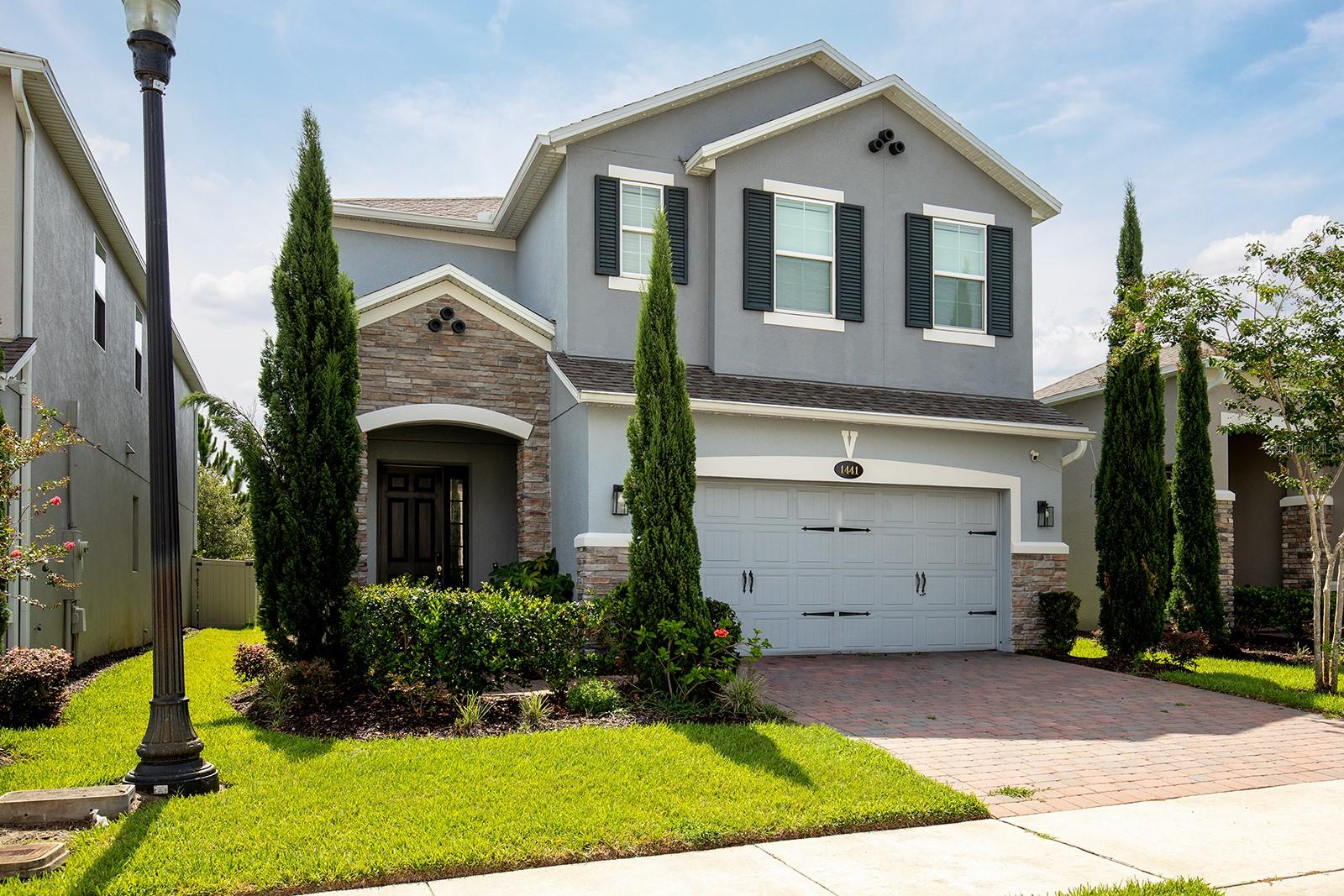 This home is located in a wonderful, gated community and has 4 bedrooms, office/den and lots of living area on the first floor for entertainment! With the beautiful marble tile floors downstairs, wood floor upstairs in media room/bonus room as well as in Master Bedroom, there is a style of elegance. Also 3 more bedrooms upstairs with carpet flooring and the office/den downstairs which could possibly be an additional bedroom if needed. Great open floor plan which has a large kitchen, dining area and great room combination! Fantastic location with washer, dryer and water softener included. A must see!