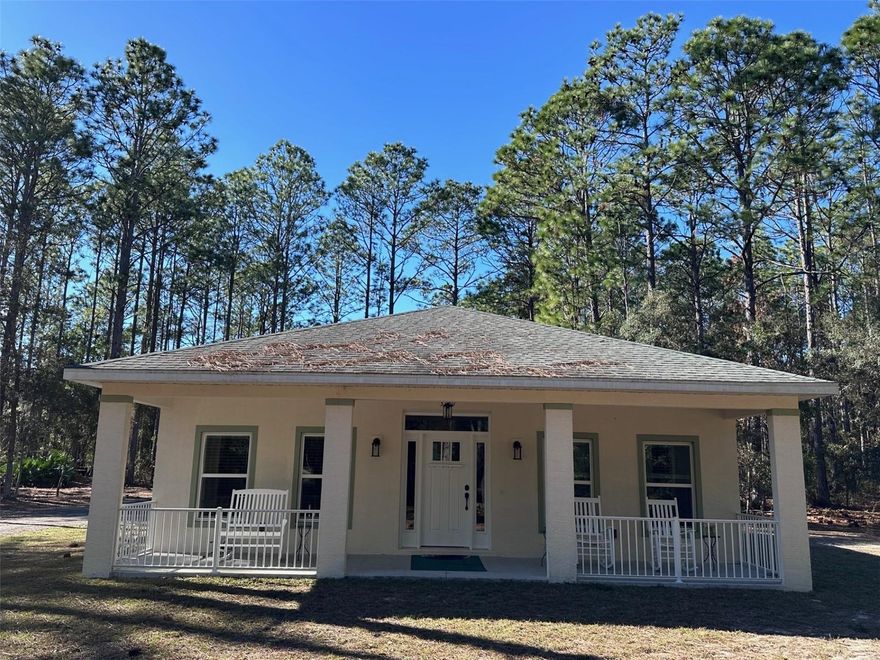 Built in 2019, this well-maintained 2 bedroom, 2 bath concrete block stucco home offers 1,295 heated and cooled square feet and sits on a private 6.76-acre parcel in Morriston, just minutes from Goethe State Forest. The open floor plan features high ceilings with tray ceilings, abundant natural light, and a spacious kitchen with ample cabinetry and counter space. Enjoy central heat and air, fiber internet availability, and peaceful views from every window. Outside, the property is well-equipped with a 30x40 metal garage/workshop with storage and 50-amp power, an attached RV carport and RV hookups on site, making it ideal for outdoor enthusiasts, full-time RV owners or hobbyists. Well and septic, room to roam, and a quiet rural setting while still convenient to Ocala and surrounding areas make this property perfect for a full-time residence, weekend retreat or homestead.
