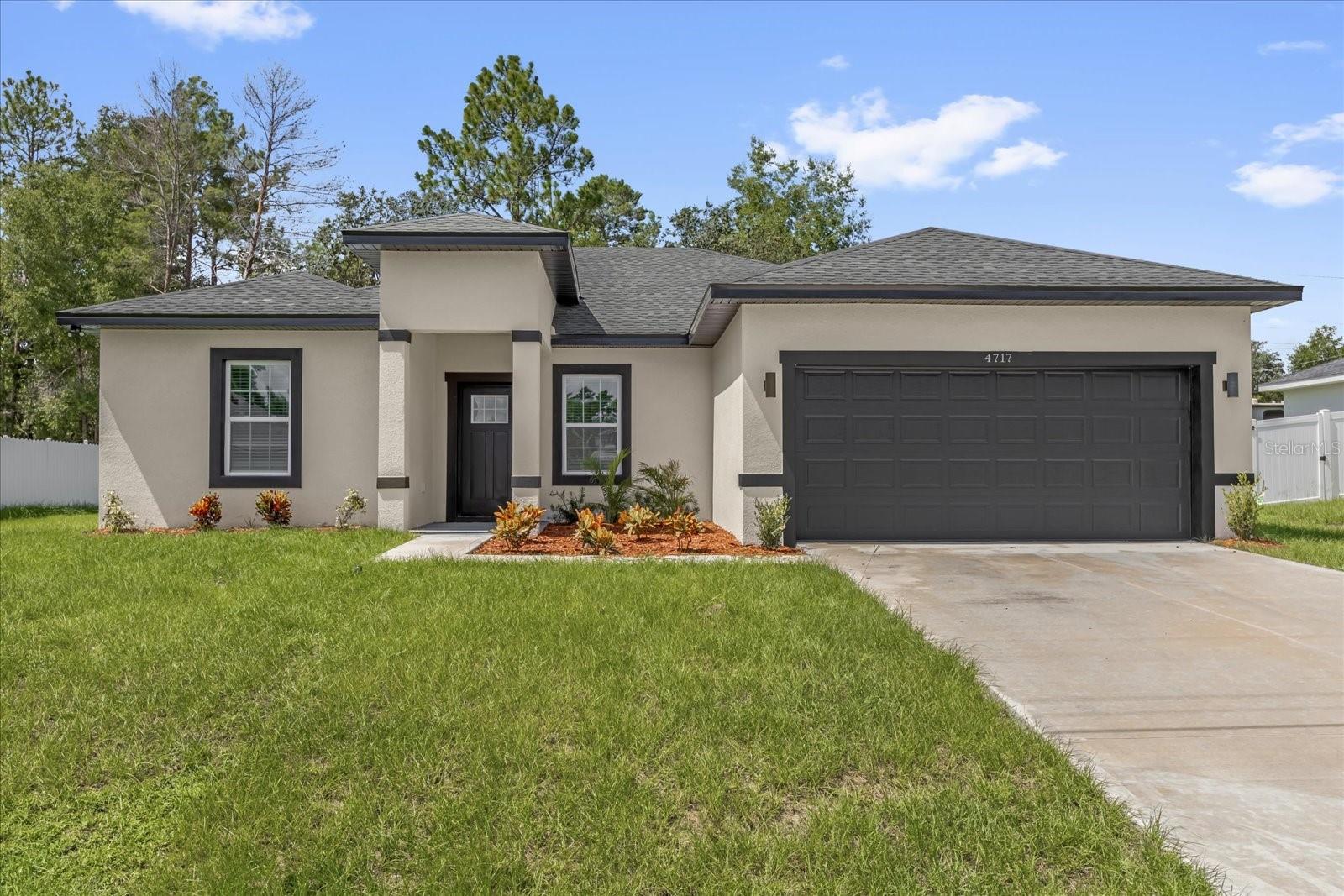 Welcome to this spacious and modern 4-bedroom, 3-bathroom home located in the heart of Marion Oaks. Boasting 1,892 square feet of living space, this home offers the perfect blend of comfort and functionality. Step inside to discover a bright and open layout. The split floor plan ensures privacy, with a generously sized primary suite that includes a walk-in closet and en-suite bathroom. The kitchen is equipped with modern finishes, ample cabinetry, and flows seamlessly into the dining and living areas—perfect for entertaining. Enjoy Florida living year-round from the covered lanai, a great spot for relaxing or hosting guests outdoors. Conveniently located near schools, shopping, and major roadways, this home is a fantastic opportunity for families, remote professionals, or anyone seeking a move-in ready property in a growing community. Don't miss your chance to make this beautiful home yours—schedule your private showing today!