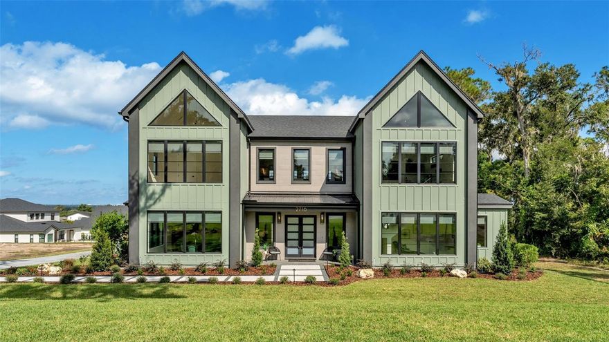 Introducing The Equinox — a Parade of Homes masterpiece by Hulbert Homes, nestled within the exclusive gated community of Delphi Hills in South Lakeland. This architectural showpiece features 5 bedrooms, 4 baths, and a 3-car side-entry garage — artistically designed for modern living and effortless entertaining.
Crowned with numerous Polk County Parade of Homes awards, including Home of the Year, Showcase Home of the Year, Pool of the Year, Landscaping of the Year, Best Floorplan, Best Exterior, and Best Primary Bath—The Equinox is a true work of art in design and craftsmanship.
Step inside and prepare to be captivated by a dramatic floating staircase, a striking centerpiece that enhances the home’s open, modern flow. A second-story catwalk overlooks the soaring Great Room, where a floating fireplace with slat-wall detail adds warmth and style. The gourmet kitchen and Great Room open seamlessly to the outdoor living retreat, complete with a poolside bar-top island and a spectacular resort-style pool with a lazy river—your own private paradise for entertaining and relaxation.
At the heart of the home, the formal dining area and gourmet kitchen define luxury and livability. Outfitted with a premium Frigidaire Professional stainless appliance package — including a gas range — this space is as beautiful as it is functional. Custom soft-close wood cabinetry, gleaming quartz countertops, and a walk-in "Super Pantry" with built-in shelving and quartz countertops provide both elegance and practicality. The oversized island with bar seating and adjacent bar area make this space perfect for gatherings. A charming formal dining space, filled with natural light, overlooks the front yard through stunning architectural windows.
The primary suite on the main level is a sanctuary of sophistication, featuring trey ceilings, accent lighting, triple sliding doors give you your own private access to the lanai and pool. A spa-inspired en-suite bath with a freestanding garden tub set within an expansive open walk-in shower, dual shower heads, dual vanities, a make-up station, private water closet, and dual walk-in closets with custom shelving. Just beyond the bath, a serene yoga studio or private retreat offers the perfect space for reflection and renewal.
Upstairs, a loft seating area with wet bar extends your living space, while the second-story balcony provides scenic views of Lakeland and the downtown skyline. Thoughtful design details in the Great room include floating shelves crafted from beams salvaged from the original cabin that once stood on the property—a nod to the home’s history, beautifully reimagined for today’s lifestyle.
Additional highlights include: Magic Glass privacy doors at the front entry, trey ceiling and crown moulding in the primary suite, a mudroom off the 3-car garage which boasts built-in storage and epoxy floor, and an outdoor fireplace, TV, and wet bar on the lanai.
A rare opportunity to own one of Hulbert Homes’ most distinctive designs, The Equinox blends artistry, innovation, and refined South Lakeland living in perfect harmony. Delphi Hills offers an intimate setting of custom homes in a private gated community — convenient to shopping, dining, and top-rated schools. Experience refined Florida living in one of Lakeland’s most coveted gated enclaves.