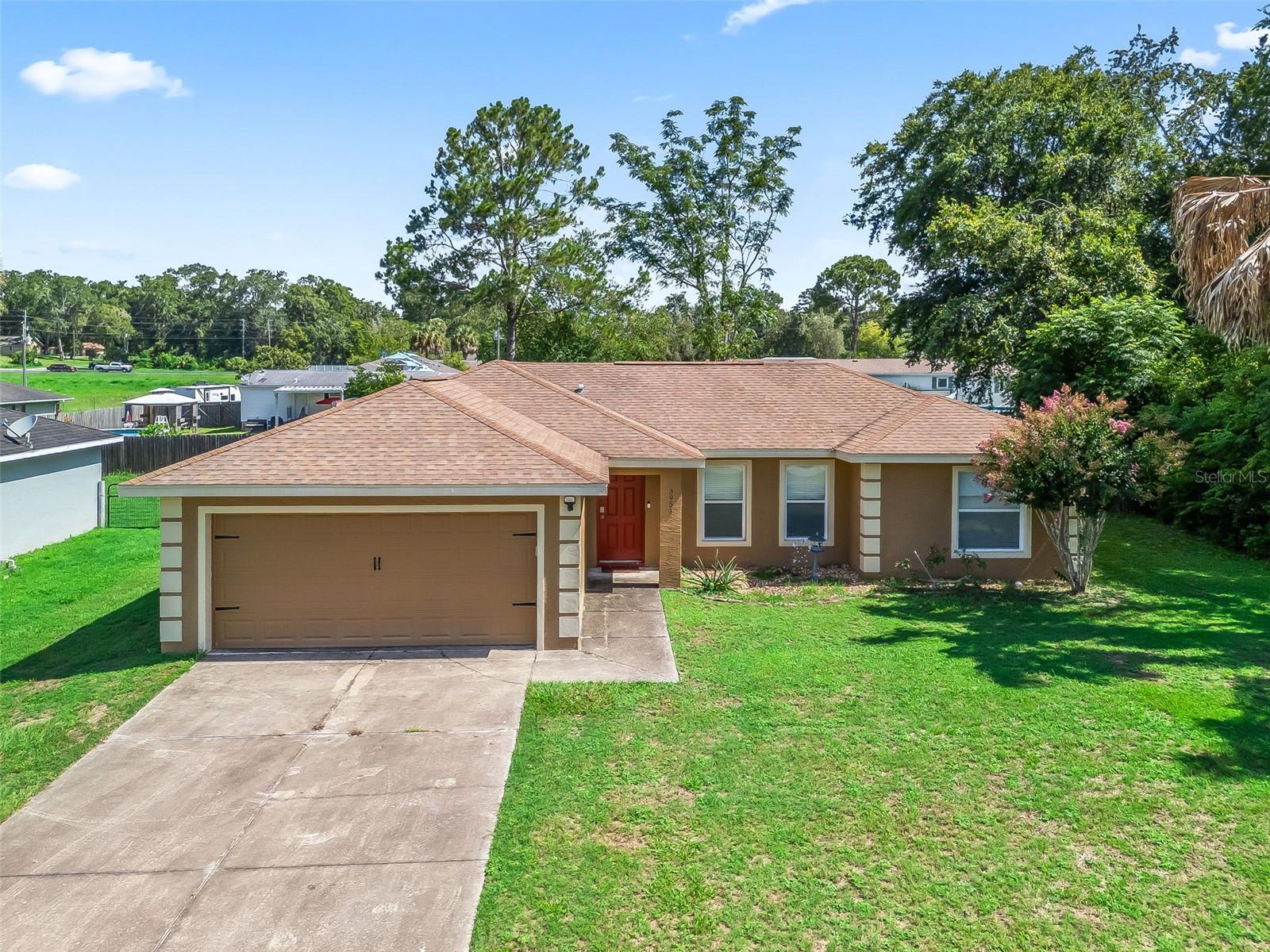 Welcome home to this beautifully maintained 3-bedroom, 2-bath, 2-car garage gem in Belleview Heights Estates! Offering 1,296 sq ft of comfortable living space, this home is ideal for hosting gatherings with family and friends. Enjoy peace of mind with a BRAND NEW ROOF (2025). The split floor plan provides added privacy, separating the primary suite from the guest bedrooms. The fully fenced backyard offers a secure space for family and pets, while the screened-in back porch is the perfect place to unwind and enjoy peaceful Florida evenings. Located in a quiet, established neighborhood with fantastic curb appeal—this home is move-in ready and waiting for you!