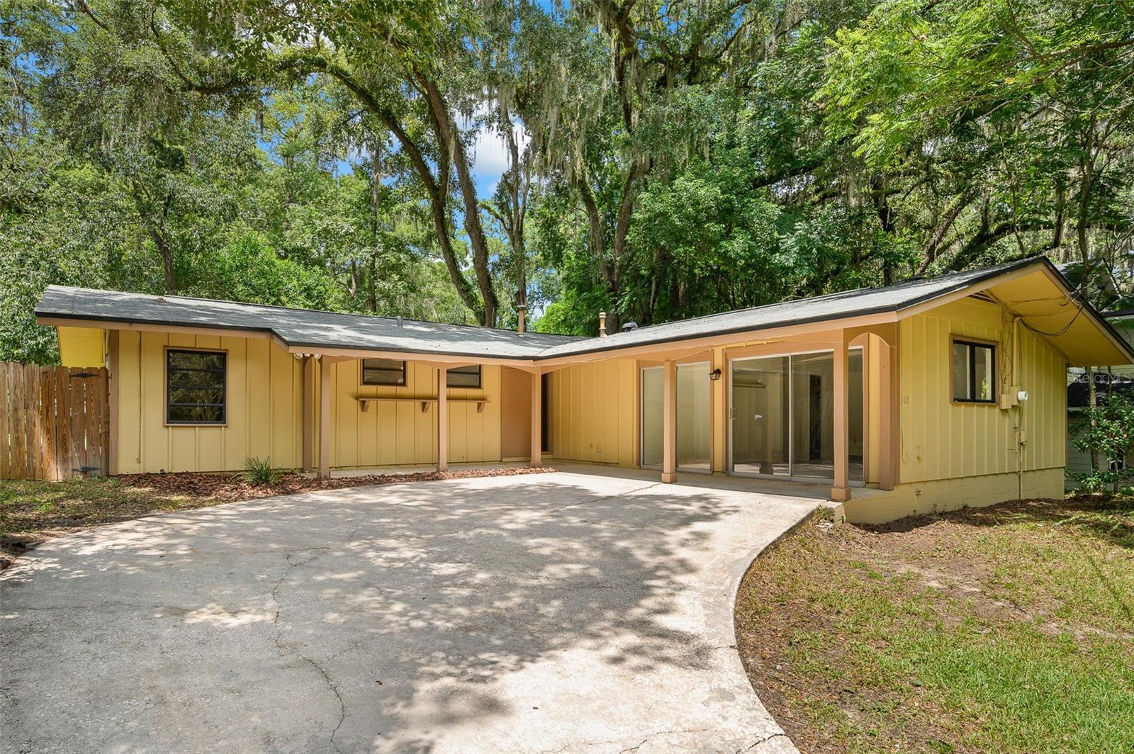 One or more photo(s) has been virtually staged. Spacious 4-Bedroom, 3-Bath Home in Prime Gainesville Location – No HOA!
This well-maintained property offers incredible flexibility for a primary residence or investment opportunity. Featuring 4 bedrooms and 3 full baths, including two bedrooms with private en-suite bathrooms, it’s perfect for families, roommates, or rental income. Recent updates include a new hot water heater, fresh interior paint, and new carpet in the primary bedroom. Kitchen includes granite countertops, stainless steel appliances, a double sink, and sliding glass doors to a deck, perfect for an outdoor grill. The laundry room with utility sink comes equipped with a washer and dryer for added convenience. Additional highlights include freshly cleaned tile and grout throughout, a spacious floor plan, plenty of parking, and no HOA restrictions. 4 point inspection (Roof, Plumbing, Electrical, HVAC) was conducted in June. Discrepancies have been repaired. Report and Invoices are available.
Location is everything—according to Google Maps, you’re just .4 miles to UF Law School and 1.5 miles to Ben Hill Griffin Stadium. Convenient to campus, shopping, dining, and entertainment, this home is move-in ready and ideal for both living and leasing.