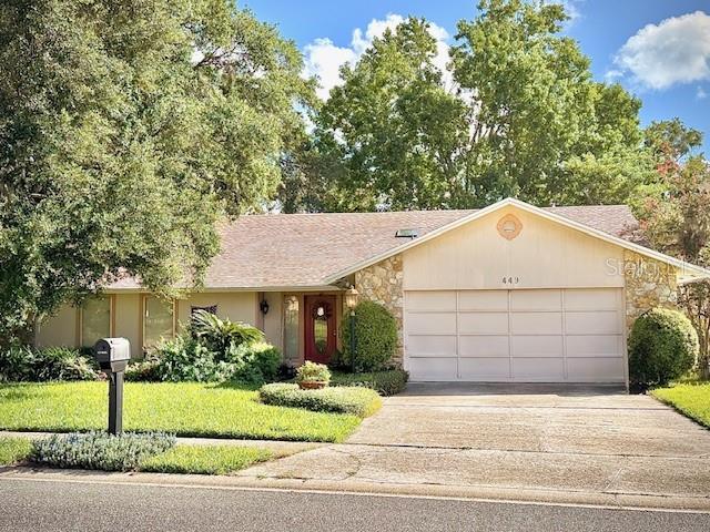 STONEWOOD. This desirable community is located in Maitland, Seminole County City limits. This four bedroom, two bath, beatiful lakefront home awaits you! Do not miss out on this wonderful opportunity. Stonewood subdivision is a beautiful area under beautiful mature oak trees with a well kept yard. The home sits high above with the view of the lake. In addition, the home has vaulted ceilings and a wood burning fireplace. Two of the rooms are walled with Pella windows looking over the lake. The kitchen and dining area are adjacent to one another and have Pella doors leading to the outside deck. The floors are a combination of carpet, large light tiles, and Bruce wood floors. This home is located near churches, schools, the Maitland Center and I4, all conviently located in Central Florida. Make this home your very own to enjoy!