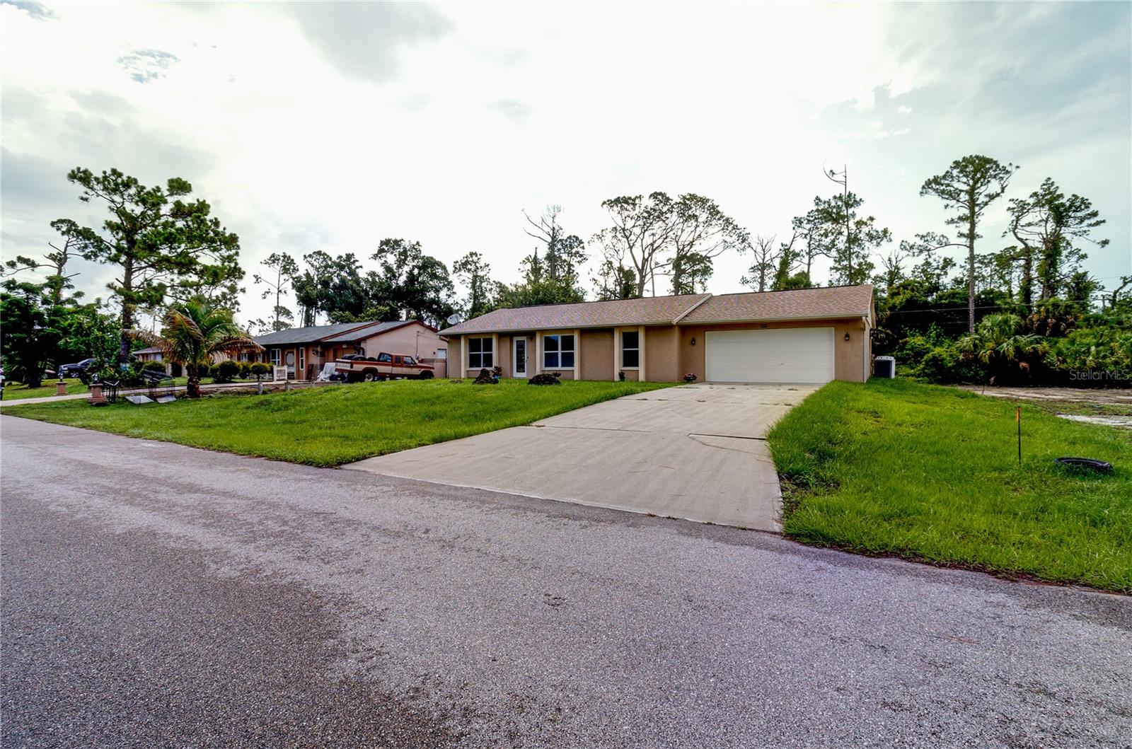 All the major upgrades have been done and this two-suite home is move-in ready. New roof and New AC in 2023 * New well pump in 2024 * New electrical panel and New septic tank in 2022 * Electric water heater in 2021. This spacious 2-bedroom and 2-bathroom home features 1,272 sq. ft. The living room is open and airy. The Newly upgraded gorgeous kitchen has plenty of counter space and boasts all stainless-steel appliances. Each bedroom has its own bathroom. Both bathrooms were upgraded with New vanities. The house is freshly painted and has New modern fans in every room. Situated on approximately a 1/4 acre lot, the property offers a well-maintained backyard, ideal for relaxation and outdoor activities. Conveniently located, this home provides easy access to key areas including Port Charlotte, Englewood, Wellen Park, and Venice. Nearby amenities embrace shopping centers, hospitals, schools, and the Centennial Park with numerous recreation facilities, making it a desirable choice for families and professionals alike.