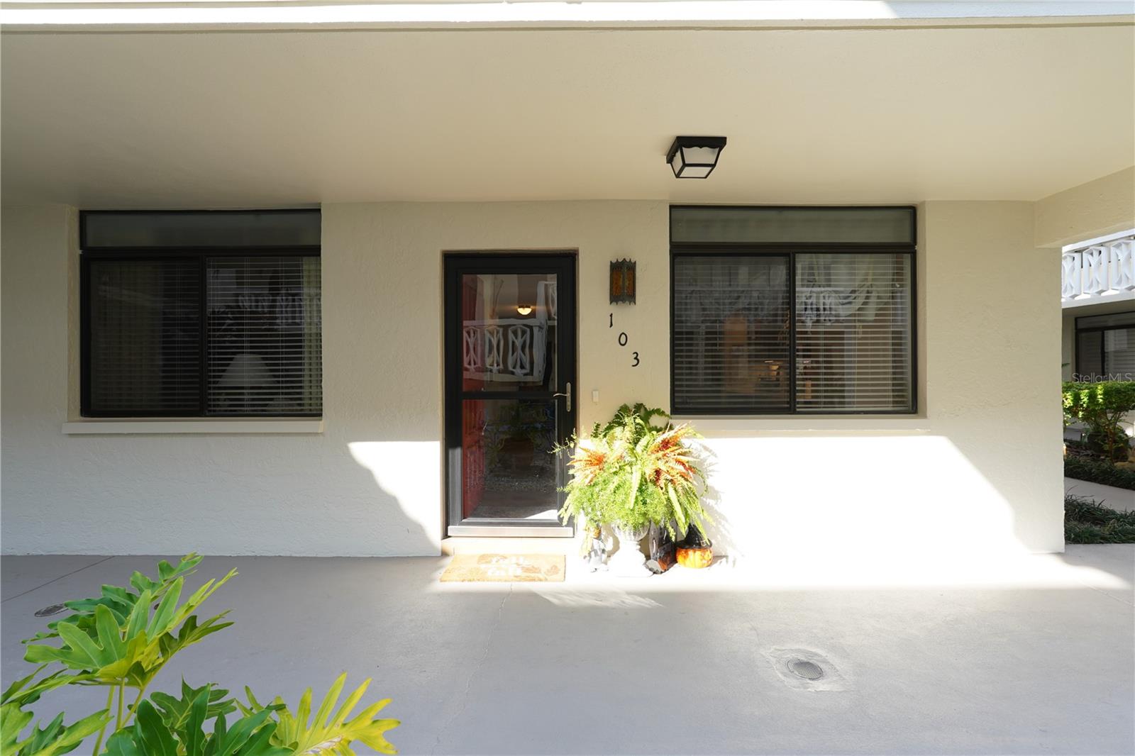 Perfection at its best!  Building 8 is a 55+ building.  This ground floor corner unit shows like a dream home.  Kitchen updated with new tile backsplash, quartz countertops and new stainless refrigerator.  The living/dining area is large enough for a full size dining table and buffet and the living room is very roomy.  Floor to ceiling sliding doors open to the stunning private patio with brick wall enclosure and wrought-iron gate.  Parking space right behind patio.  Remote control shade on the slider keeps the afternoon sun out.  Master bedroom boasts a walk-in closet and the bath vanity is updated with quartz countertop plus the tile shower has updated hardware.  Generous sized linen closet in the space outside 2nd bathroom.  2nd bedroom very roomy with large walk-in closet, and the hall bath has updated vanity and updated hardware in the tub.  New roof installed a few months ago and the Seller will pay roof assessment at closing.  Small pets are allowed, but only 1 in each unit.  Seville really has it all - centrally located to Clearwater Mall, Costco, Lowe's and many restaurants.  As you drive through the community notice the mature trees, landscaping, retaining walls, parking areas - it feels like another world.  The community boasts a Clubhouse, Exercise room, and a gorgeous heated pool with restrooms and showers.  Schedule your private tour today.