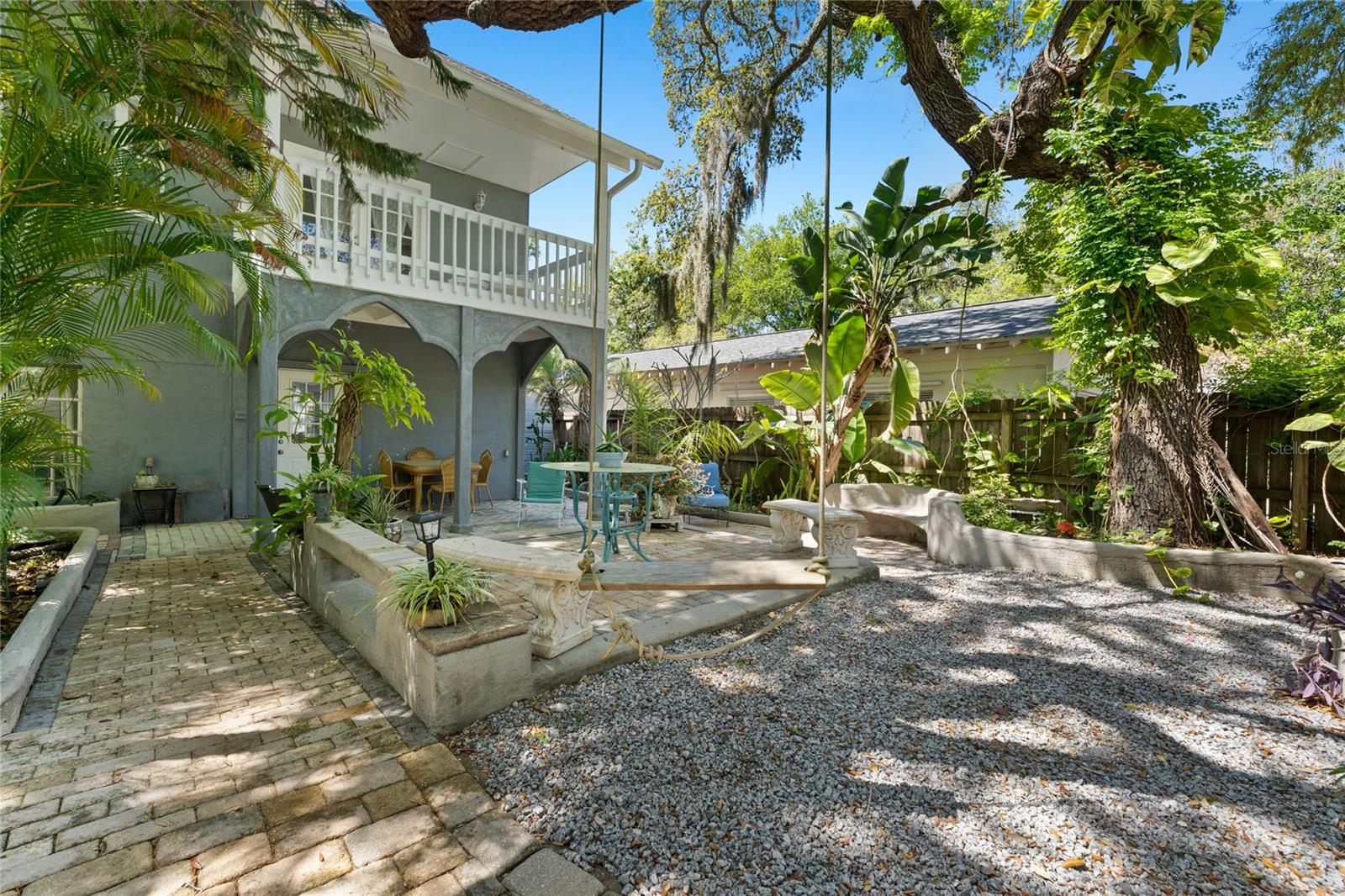 Welcome to your temporary oasis in Crystal Beach, Florida!
Nestled behind welcoming gates, this enchanting furnished short-term rental blends eclectic charm with artsy character, creating the perfect setting for a memorable stay.
Charming Outdoor Spaces:
Step through the gates into a magical garden filled with lush greenery and whimsical blooms. This private retreat sets the tone for relaxation, creativity, and comfort.
Spacious & Comfortable Living:
3 Bedrooms | 2 Baths
On the first floor, enjoy a private queen bedroom for peaceful rest.
The great room combines the kitchen, living room, and breakfast bar—perfect for gathering and casual meals. For sit-down dining, the formal dining table seats eight.
A washer & dryer are onsite for your convenience.
Second-Floor Retreats:
Primary Bedroom Suite: King bed, private balcony, luxurious garden tub, walk-in shower, and an airy open-concept design.
Second Bedroom: Twin-over-full bunk bed plus a fold-out full bed—ideal for families or groups.
A cozy loft office space is available if you need to work during your stay.
Location Highlights:
Just a short stroll from Crystal Beach and the local park, offering peaceful scenery and a true coastal community feel.
Close to vibrant destinations such as Honeymoon Island, the Tarpon Springs Sponge Docks, and Clearwater Beach (12.8 miles).
Tampa International Airport is a convenient 20.4 miles away.
Peace of Mind:
This home was marked safe from the storms of 2024, offering extra assurance during your stay.
Why You’ll Love It
Every corner of this home exudes charm, from its artsy vibe to its inviting layout. Whether you’re soaking in the garden tub, sipping coffee on the balcony, or enjoying a quiet evening after a day exploring the coast, this home is designed to make your Florida stay unforgettable.
Available for 30-day minimum stays – Pack your suitcase and come experience the magic of Crystal Beach!