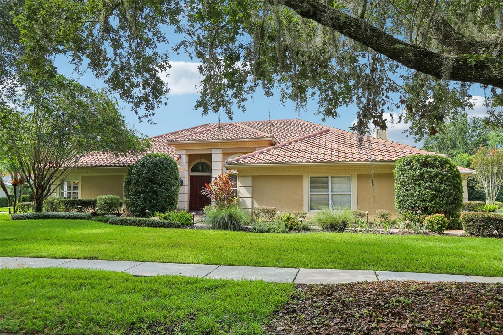 Prepare to live the ultimate Florida lifestyle in this magnificent 6-BEDROOM, 4.5-BATHROOM ESTATE, OFFERING OVER 4,400 SQUARE FEET of luxurious living space on a sprawling lot of NEARLY HALF AN ACRE. Perfectly positioned within the upscale, GATED COMMUNITY OF MAGNOLIA CHASE IN HUNTER’S GREEN, this home's design is both beautiful and practical, ideal for entertaining or daily comfort.
The journey begins as you enter into a bright, airy space defined by HIGH CEILINGS, FRESH PAINT, AND NEW LVP FLOORING. The home’s layout flows effortlessly from the formal living and dining areas into the heart of the home: a spectacular open-concept kitchen and family room. The showstopper kitchen is equipped with A 6-BURNER GAS STOVE, A STUNNING WOOD-FACED REFRIGERATOR, AND A MASSIVE CENTER ISLAND. A wall of sliders and convenient pass-through windows dissolve the barrier to the outdoors, creating a seamless connection to the lanai.
The expansive lanai, paved with elegant travertine, features a HEATED SALTWATER POOL AND SPA, A BUILT-IN OUTDOOR KITCHEN SPACE, and ample room for lounging and dining al fresco. The COZY GAS FIREPLACE in the adjacent family room ensures this entire space is the hub of activity, year-round.
When it's time to unwind, the luxurious primary suite offers a true escape, complete with a SPA-LIKE BATH FEATURING A GORGEOUS CUSTOM-TILED SHOWER. An ATTACHED SITTING ROOM rounds out the beautiful suite. The home's clever SPLIT-BEDROOM FLOOR PLAN provides privacy and convenience for all, with FIVE ADDITIONAL BEDROOMS—including one with direct pool access, another with a private en-suite bath, and two connected by a Jack-and-Jill bath.
The expansive BONUS ROOM is the ultimate recreation center, featuring a BUILT-IN WET BAR, WINE FRIDGE, AND INTEGRATED SPEAKER SYSTEM, ready for movie nights or celebrating big wins. Practical features abound, including A 3-CAR SIDE-ENTRY GARAGE, A DURABLE TILE ROOF (2017), PLANTATION SHUTTERS, AND A WELL-APPOINTED LAUNDRY ROOM.
This is more than a home; it's a lifestyle in a location that can't be beaten. Enjoy convenient access to major highways, with a short 30-minute drive to Downtown Tampa. You are just moments from USF, Moffitt Cancer Center, other major hospitals and medical facilities, fantastic retail, diverse restaurants, and of course, the fabulous Hunter's Green Golf & Country Club. Don't miss this rare opportunity to have it all!
