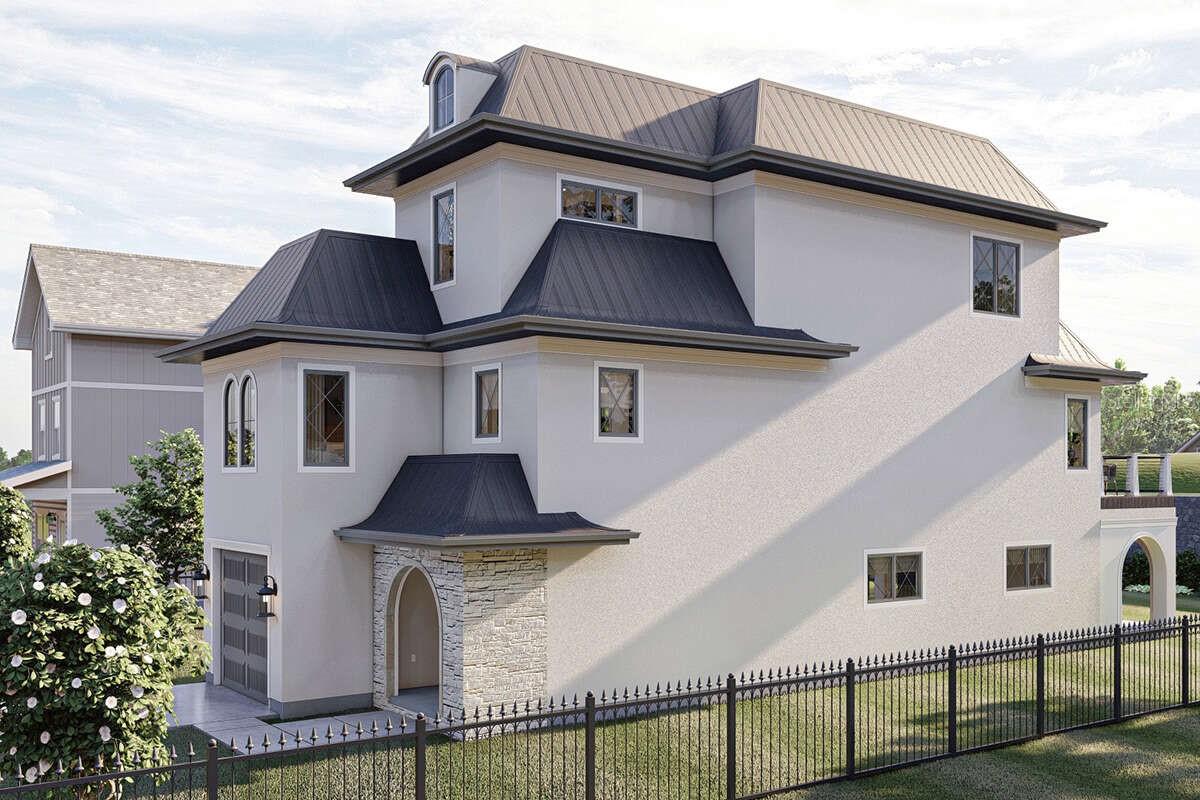 Pre-Construction. To be built. Welcome to this exceptional 4-bedroom, 2 full / 2 half-bath, 3-story residence offering 2,774 sq. ft. of heated living space with timeless architectural detail and modern luxury. From the moment you arrive, the home’s arched entry, stone accents, and dramatic rooflines set the tone for its distinctive style. Inside, you’ll find elegant design and thoughtful craftsmanship throughout. The main level opens to a spacious family room with fireplace and custom built-ins, flowing seamlessly to a covered porch ideal for entertaining or relaxing. A private elevator provides convenient access to all three floors. The heart of the home is the chef’s kitchen, featuring an oversized island, sleek cabinetry, high-end fixtures, and a walk-in pantry. Open to the great room and dining area, this space is perfect for gatherings, with doors extending to a large deck for indoor/outdoor living. The primary suite is a true retreat with a spa-inspired bath including dual vanities, a soaking tub, and a walk-in shower. Upstairs, three additional bedrooms and a full bath provide ample space for family, guests, or home office needs.
Outdoor living is just as impressive, with a covered porch, expansive deck, and fenced yard. A 1-car garage and gated entry add convenience and security. This home is a rare blend of style, function, and architectural character — perfect for buyers seeking a statement property with everyday comfort.