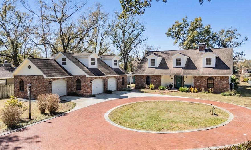 Nestled in the HEART of LUTZ, where homes RARELY come to market - this charming LAKEFRONT estate offers a peaceful retreat without sacrificing the convenience of the city.  Situated on a generous 1-ACRE parcel with PRIVACY and space galore - this property boasts a custom built, one owner home, PLUS a 3.5-CAR GARAGE with an “APARTMENT” above it – all set against the backdrop of beautiful Tiffany LAKE.  This property truly stands out with its custom-built features, offering a unique charm that sets it apart from the “cookie-cutter” homes of today.  Spanning 3,247 square feet, this METICULOUSLY MAINTAINED home truly showcases CLASSIC CHARM and too many distinctive ARCHITECTURAL DETAILS to list!  The BRICK CIRCULAR DRIVEWAY offers a stunning first impression and abundant parking for all.  Upon entering the home, your eyes don’t know where to focus first – the STUNNING double-sided BRICK FIREPLACE, the STAIRCASE with its original wood stair rail, or the double FRENCH DOORS leading to the LANAI offering a beautiful view of the LAKE or how OPEN & ROOMY the living space is! Retreat to the FIRST-FLOOR spacious PRIMARY SUITE - at almost 15’ x 24’.6”, it offers ample room for relaxation and personalization, it boasts a picturesque view of the LAKE, cozy BRICK FIREPLACE, large closet, ensuite bathroom with a garden tub & separate shower, and a flex space that could serve as a vanity or a small workspace. The HUGE, classic-style kitchen with stunning lake view offers endless cabinet & countertop space, a central ISLAND, and LARGE EAT-IN NOOK!  Off the kitchen, the dedicated FORMAL DINING ROOM is perfect for special occasions. Upstairs features a smart, comfortable layout with a spacious full bathroom, TWO EXTRA-EXTRA-LARGE BEDROOMS seamlessly connected by a central BONUS ROOM – perfect for a playroom, home office, teen hangout, art/craft studio...the ideas are endless! The views of your MASSIVE BACKYARD and the BEAUTIFUL LAKE are certainly a highlight in every room of this home!  THE TRUE GEM of this estate is the spacious PRIVATE “APARTMENT” over the 3.5-car garage, boasting a large full bathroom, kitchenette area, and ample living space - ideal for guests, workspace, or IN-LAWS!  Enjoy all the PEACE AND TRANQUILITY here - relaxing on your lanai while cooking out on your built-in Jenn-Air grill…or relaxing on YOUR PRIVATE DOCK on the LAKE!! Bring your BOAT, kayak, or FISHING pole! You will LOVE the PRIVACY while remaining a short drive to all conveniences – less than 15mins to the Veterans Expressway, less than 15mins to I-275, 10mins to N Dale Mabry Hwy, and 10mins to SR54! INCREDIBLE LOCATION!!!  NO deed restrictions, NO HOA, and NOT in a flood zone!  Don’t miss this rare opportunity!