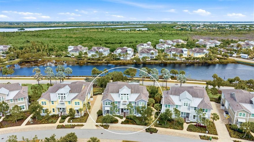 Live the coastal lifestyle you’ve been dreaming of in the gated, resort-style community of Harbour Isle. Begin each day in your light-filled sunroom, sipping coffee as the sun rises over the tranquil lagoon. This beautifully maintained Bermuda floor plan coach home offers 2 bedrooms plus a versatile den (currently used as a third bedroom) and 2 full baths, all thoughtfully designed with upscale finishes throughout. From plantation shutters and French doors to the vaulted, beamed ceiling, shiplap accents, tray ceilings, crown molding, solid core doors, built-in closets and the private elevator-every detail adds functionality and charm. The kitchen is both stylish and functional, featuring wood cabinetry, stainless steel appliances, granite countertops, a walk-in pantry, and a large island with breakfast bar-perfect for entertaining. Retreat to the spacious owner’s suite with dual vanities, shower, and walk-in closet. The oversized side-load 2-car garage with extra closet storage has space for all your beach essentials. Built with efficiency and durability in mind, this LEED-certified home includes PGT impact-rated windows and quality construction throughout. Explore miles of neighborhood paths and find an inviting hammock for an afternoon siesta. The home is conveniently located right across the street from one of the community pools which makes it so easy to enjoy a refreshing swim or an afternoon of lounging in the sunshine. Or check out one of the 3 additional pools in the community, each with their own special features. End your day with an incredible sunset at the amazing 23,000 sq ft Beach Club over-looking Anna Maria Sound, the crown jewel of the community. The Beach Club features resort-style amenities with resort pool and hot tub, the Sky Bar, Lounge, restaurant, state-of the-art fitness center, yoga lawn, event lawn and private beach where you can launch your kayak in the Sound. Just over the bridge, Anna Maria Island awaits with its sugar-sand and laid-back charm. What are you waiting for? It’s time to start living your best life in Harbour Isle!