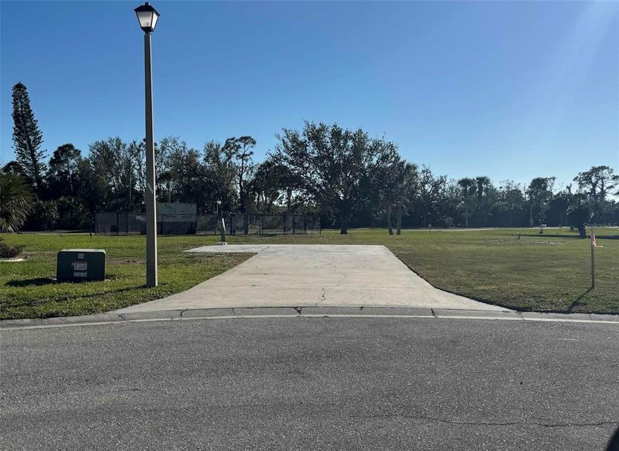 This great lot is ready for your new home in the beautiful Gasparilla Pines 55+ Community. Just a short drive to the Gulf beaches of Boca Grand Island and Manasota Key. Electric, public water & sewer availability for hook up and concrete pad is in place. Boating, fishing, golfing, nature trails, shopping and dining are all just a short drive. LOW HOA FEES of only $200 a year and you OWN YOUR OWN LAND. Come make your Florida paradise dream home a reality.