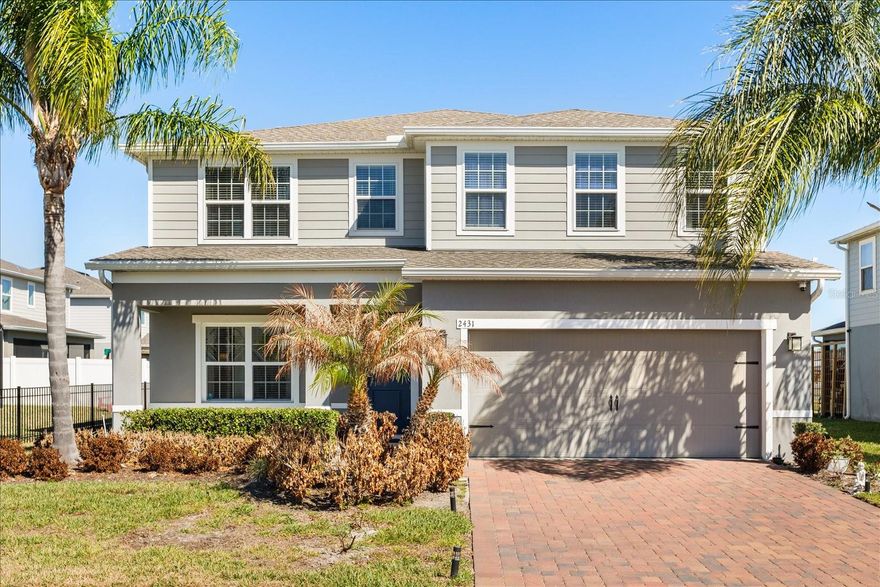 One or more photo(s) has been virtually staged. CLEAR YOUR SCHEDULE - You've found your NEXT HOME in this Kensington Reserve property!! This is one of Sanford’s most desirable gated communities, where modern design meets everyday ease. This stunning 4-bedroom, 3-bath home with a dedicated office and spacious loft offers 2,721 sq ft of bright, beautifully designed living space — and it shows like a model. From the moment you walk in, the open-concept layout feels effortless and inviting. The chef-inspired kitchen is the heart of the home, featuring sleek stone countertops, a marble-style backsplash, stainless steel appliances including a true double oven, and an oversized island perfect for gathering. It flows seamlessly into the expansive family and dining areas, all overlooking peaceful pond views. The main floor includes a private office plus a full bedroom and bath — ideal for guests or multigenerational living. Upstairs, a generous loft creates the perfect flex space for a media room, playroom, or second lounge. The primary suite is a true retreat, complete with a spa-like bath and two oversized walk-in closets. Step outside to your covered lanai with panoramic screens and soak in serene water views and Florida sunsets. Additional upgrades include smart home features, smart switches throughout, and an electric vehicle charger already installed. Located just minutes from the 417, historic downtown Sanford, Lake Monroe’s waterfront dining and marina, and an easy drive to New Smyrna and Daytona beaches, this home offers the perfect blend of convenience and lifestyle. Move-in ready. Impeccably maintained. Perfectly located. Homes like this in Kensington Reserve don’t sit long — come see why!