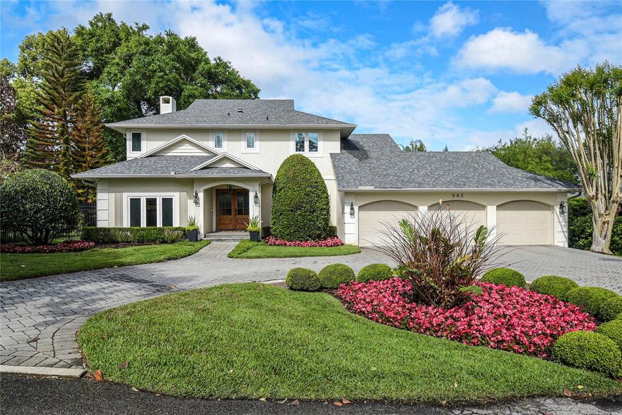 Welcome to Timberlane Shores—one of Winter Park’s most desirable neighborhoods! This beautiful 4-bedroom, 4.5-bath home sits on over a third of an acre in a quiet, tucked-away location with gorgeous updated landscaping. Inside, you’ll find wide-plank hardwood floors throughout and a thoughtfully designed floor plan with separate living and dining rooms plus a spacious family room. The bright kitchen features white cabinetry with pull-out drawers, marble countertops, subway tile backsplash, and newer appliances (2018), including a Sub-Zero refrigerator and Wolf gas 4 burner range.  The kitchen opens to a bright sunroom with beautiful wood-like tile floors laid in a herringbone pattern (2018).  Such a great space that is filled with natural light—perfect as a casual gathering space or playroom, making this an ideal home for entertaining. The sunroom overlooks the enormous backyard space and large pool area with custom designed pavers (2023). A downstairs guest suite with full bath provides comfort and privacy, while a dedicated office with built-in desks and brand new carpet adds functionality. Upstairs, the oversized primary suite boasts a beautifully appointed bathroom with dual sinks, marble countertops, soaking tub, and separate walk-in shower, along with a custom walk-in closet. Two additional upstairs bedrooms each offer en-suite baths, including one renovated in 2021.
Recent updates include new windows (2017), solid wood front door (2021), renovated bath (2021), two new AC units and duct cleaning (2024), and a new roof (2024). This exceptional home offers the perfect blend of style, comfort, and location—truly a must-see.