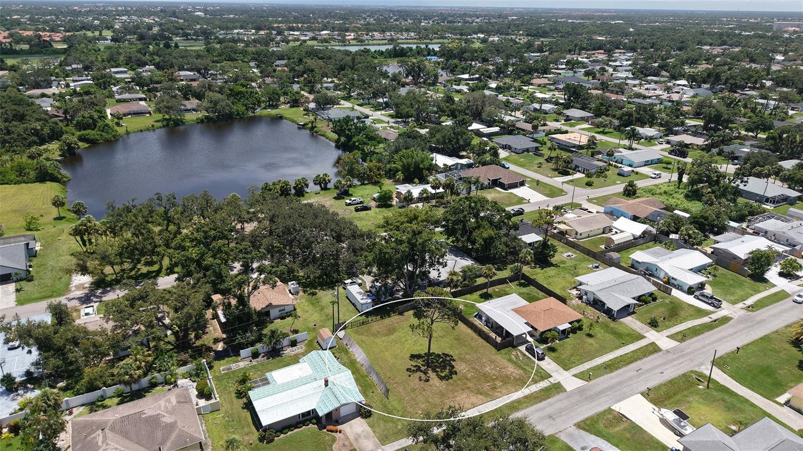 Discover the perfect canvas for your dream home on this level 80 x 100 ft lot, tucked away on a quiet street in the heart of South Venice. This peaceful, laid-back neighborhood offers a rare blend of space, flexibility, and freedom.
Located in Flood Zone X, so no flood insurance is required, the property offers peace of mind along with picturesque surroundings, mature oak trees on the neighboring property and glimpses of a serene lake in the distance create a beautiful, tranquil setting for your future outdoor living. With no CDD or HOA fees, you’ll enjoy the freedom to build without added costs or restrictions. Bring your own builder or use ours, set your own timeline, and create the lifestyle you’ve always envisioned.