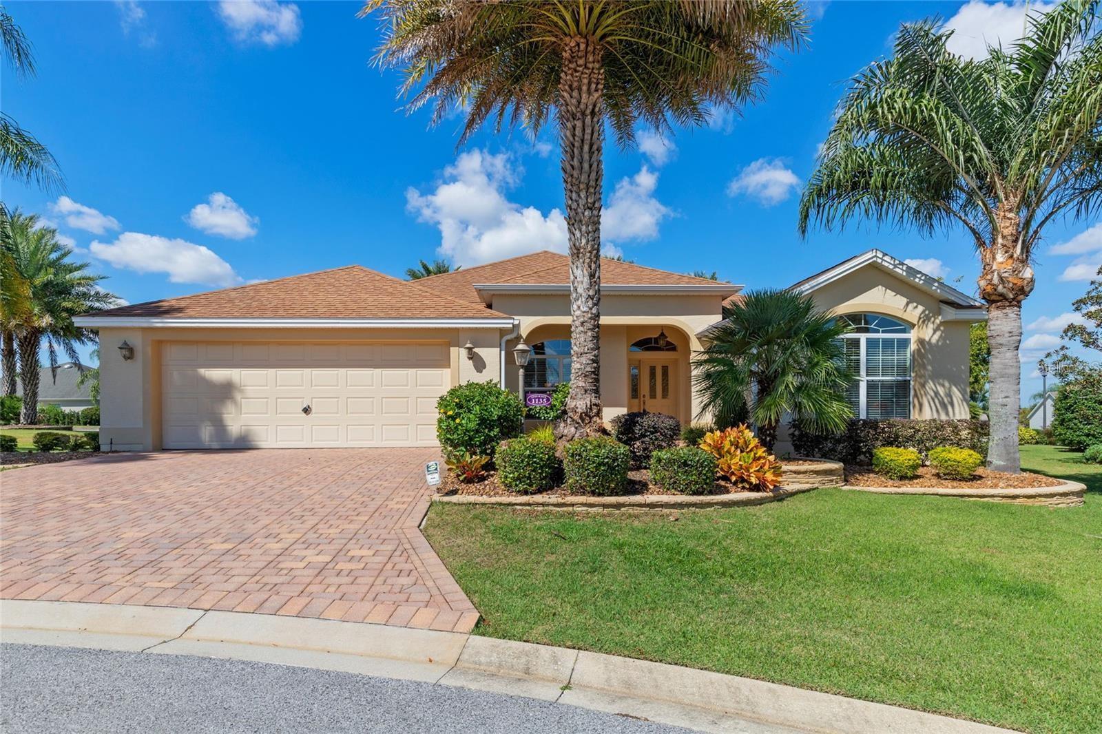 Welcome to the VILLAGE OF HEMINGWAY! This charming GARDENIA MODEL is perfectly situated on a peaceful CUL-DE-SAC and just a short GOLF CART RIDE from LAKE SUMTER LANDING’S SHOPPING AND DINING.
Step into a bright interior featuring THREE SPACIOUS BEDROOMS, each with its own closet. The OVERSIZED GARAGE has room for your cars and golf cart, plus you'll love the expansive ACRYLIC ENCLOSED LANAI—ideal for relaxing or entertaining.
The kitchen is equipped with STAINLESS STEEL APPLIANCES and CORIAN COUNTERTOPS, seamlessly flowing into the open LIVING AREA with VAULTED CEILINGS. The PRIMARY SUITE is a true getaway, complete with sliders to the lanai and an EN-SUITE BATH.
Enjoy a SPLIT FLOOR PLAN for privacy, beautiful MATURE LANDSCAPING, and a PAVED DRIVEWAY that enhances the curb appeal. Additional perks include a brand new ROOF (2024), a 2020 HVAC SYSTEM, and a convenient LAUNDRY ROOM with a washer and dryer. OPTIONAL FURNITURE makes moving in a breeze!
With the nearby TRUMAN RECREATION CENTER, COMMUNITY POOLS, multiple GOLF COURSES, scenic walking trails, and vibrant social clubs, this home offers the perfect blend of comfort and convenience.