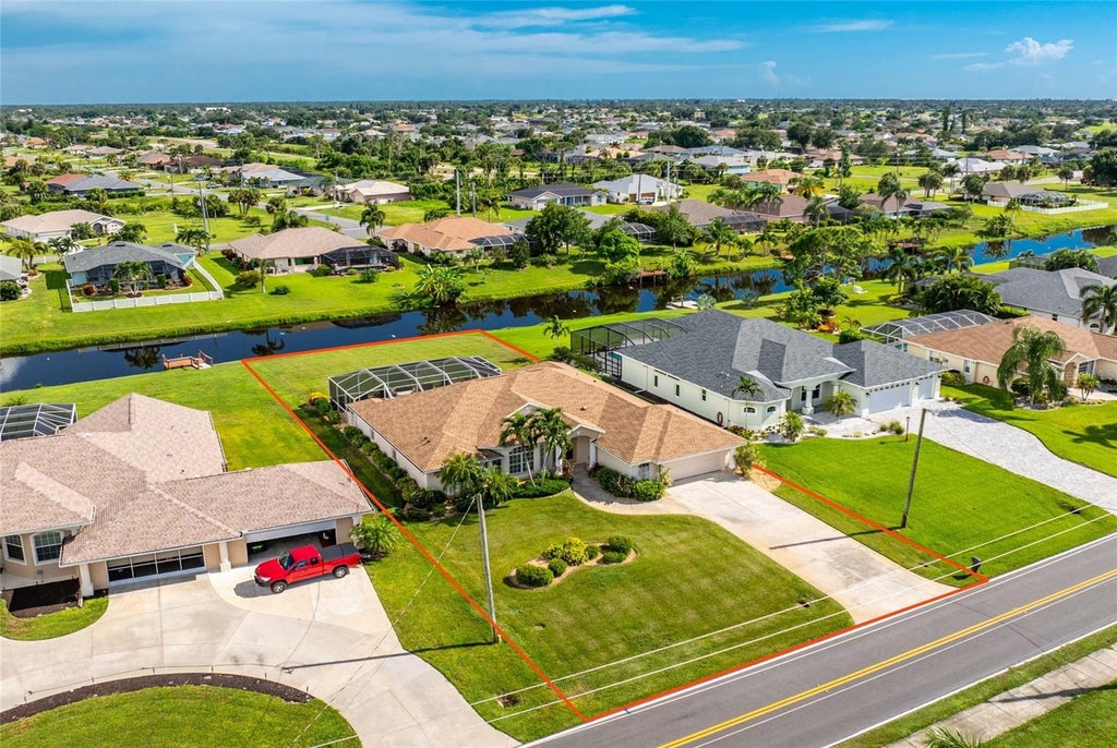 Photo of 432 Boundary Boulevard, Rotonda West, FL 33947 (MLS # D6148727)