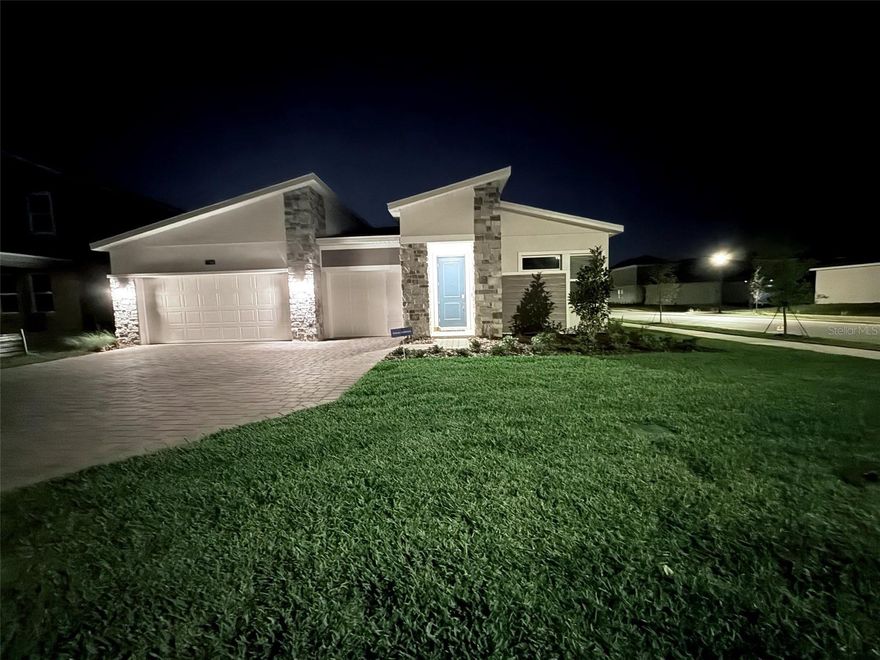 Welcome to 1744 Rider Rain Dr in the sought-after Bronson’s Ridge community of Apopka, a stunning 4-bedroom, 3-bathroom, single-story corner-lot home offering 2,560 sq. ft. of modern living with peaceful pond views. This move-in-ready residence features soaring 9- and 10-foot tray ceilings in the living room, dining room, and primary suite, 8-foot interior doors, luxury vinyl plank flooring throughout (no carpet), a gourmet kitchen with a custom Closets by Design butler’s pantry, and a spacious primary suite with a professionally designed custom closet. Additional upgrades include a 3-car garage with epoxy flooring, retractable lanai screen, automated mosquito mist system, fenced backyard with stone landscaping, designer blinds and treatments, and a new LG AI washer and dryer. Community amenities include a pool, playground, EV charging stations, dog stations, and internet included in HOA fees. This north-facing home is still under transferable builder warranty (1-year customer service through December, 2 years electrical/plumbing, and 10 years structural), offering peace of mind for years to come. Conveniently located just 25–30 minutes to Downtown Orlando, 30–35 minutes to Walt Disney World, and 25–35 miles to Orlando International Airport, this rare corner-lot gem blends elegance, comfort, and practicality with every detail already taken care of.