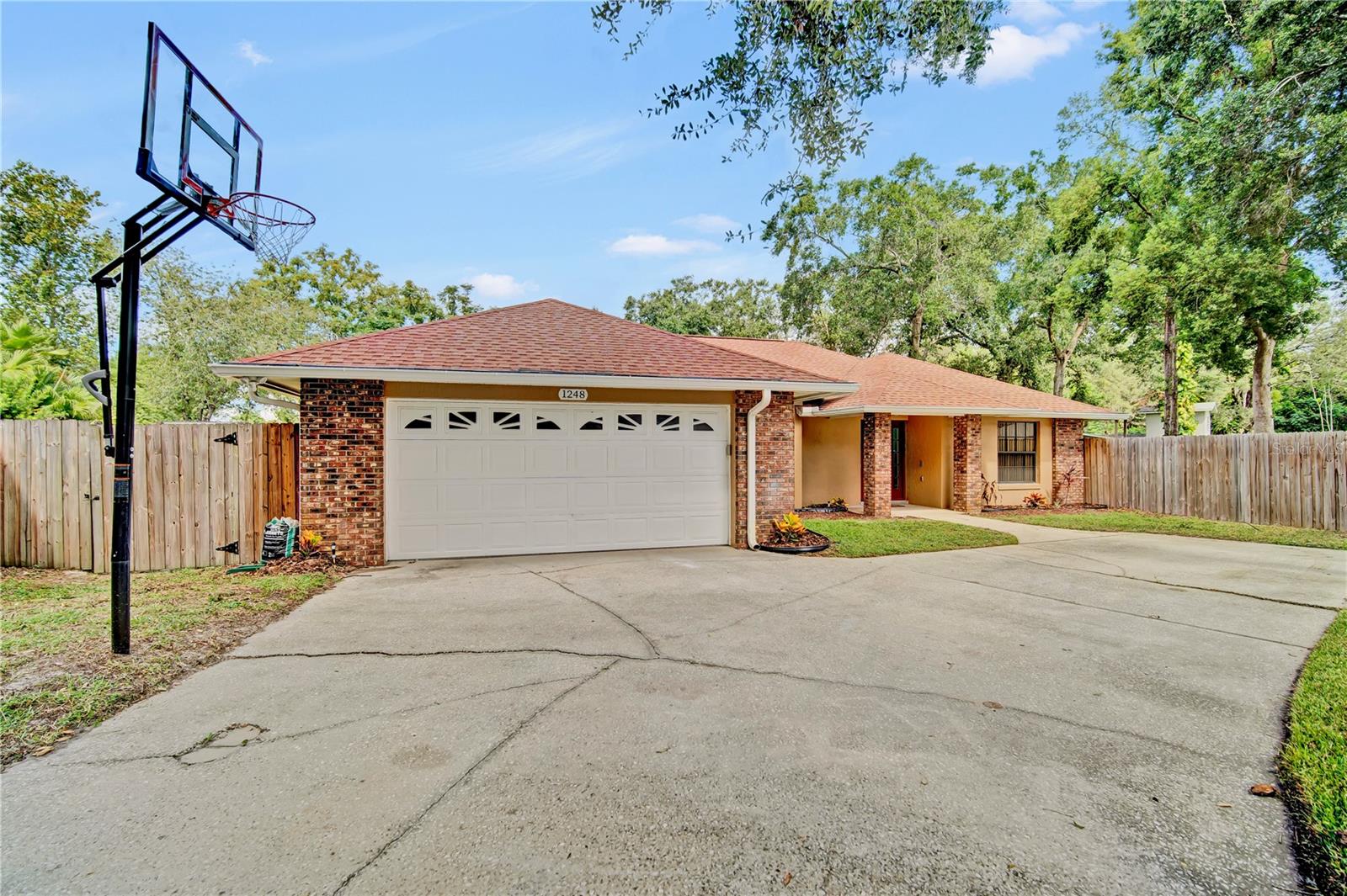 Welcome to 1248 Erik Court, nestled in a tranquil cul-de-sac in a quiet community. This beautifully maintained home combines modern upgrades with timeless comfort, offering a perfect setting for everyday living and entertaining.
Step inside to a split floor plan designed for privacy and functionality. The spacious master suite boasts a large walk-in closet and a luxurious bathroom complete with his-and-her vanities and a walk-in shower. The guest bathroom features a relaxing jetted tub, ideal for unwinding after a long day.
The heart of the home is the updated kitchen, highlighted by elegant quartz countertops, which flows seamlessly into the living areas. High ceilings and skylights fill the space with natural light, while the wood-burning fireplace creates a warm and inviting atmosphere—perfect for the holidays.
Enjoy the outdoors year-round in the enclosed back patio, or step out into the spacious fenced-in backyard, complete with a storage shed for added convenience. The extended driveway provides plenty of parking for family and guests.
Key updates include:
HVAC (2014)
Roof (~12 years old)
Water Heater (2021)
With its desirable location, thoughtful upgrades, and inviting features, this home is ready to welcome its next owners.
