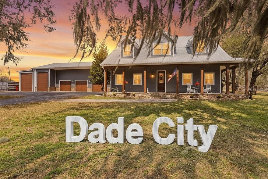 Custom 2019 Home on 1 Acre | Guest Suite | RV Garage | Workshop | Massive
Patio....
Dade City has a hidden gem! This rare opportunity offers a one-of-a-kind custom home built in 2019 by a general contractor as his personal forever home. Situated on 1 private acre with wide open field views and shaded by beautiful old trees, this property offers privacy with no HOA or CDD.
The thoughtfully designed home features over 3,000 sq ft with 4 bedrooms and 3.5 baths, including a private mother-in-law suite of more than 500 sq ft with kitchenette, bedroom, bath, private exterior entrance, interior access, and its own septic system—perfect for multigenerational living, guests, a home business, or rental potential.
From the moment you enter, soaring ceilings with white pine finished ceilings are highlighted by authentic 200-year-old reclaimed barn wood beams, posts, and custom doors, creating warmth, character, and craftsmanship rarely found in newer homes.
The chef’s kitchen is designed for everyday living and entertaining, featuring Solostone quartz countertops, Café glass cooktop, wall-mounted Café double ovens, drink mini-fridge, dedicated coffee bar, large island, and a peninsula with bar seating for four. Most base cabinets include roll-out drawers for easy access and storage, and all appliances convey.
The primary suite is conveniently located downstairs and features a spa-inspired bath with granite shower tile, dual shower heads, and rain head system. The first floor has porcelain tile throughout, while the second level offers LVT flooring, two oversized bedrooms, full bath, large loft area with an authentic brick wall, which would look great on your zoom calls, or ideal for a media room, office, or playroom, and additional storage space.
Outdoor living is exceptional. Enjoy a wrap-around paver porch on three sides, a massive 36’ x 42’ patio for entertaining, fenced yard, and an amazing private custom children’s play palace. The property also offers plenty of private parking and room for recreational vehicles or additional toys. A Jacuzzi-style swim spa and furniture may remain with acceptable offer (outside of home purchase).
From the exterior the home appears to have six garage bays offering incredible flexibility. One bay serves as the mother-in-law suite entrance; another is a workshop of your dreams with a mezzanine featuring more than 500 sq ft of storage beyond your imagination, plus an enclosed RV garage with 50-amp plug and spray foam insulation. This is truly a garage enthusiast’s dream.
Built for durability and efficiency, features include 26-gauge commercial metal roofing, open-cell spray foam insulation, Hardie concrete siding, 2x6 pressure-treated framing pre-treated for insect prevention, generator prep with wiring and transfer switches installed, plus a private wrought iron gated entrance and fenced front yard.
Located in the rolling hills of Dade City, this charming town offers peaceful country living with character and history. Known for horse properties, oak-lined streets, unique shops, and events like the Kumquat Festival, residents enjoy a welcoming community with easy access to Tampa and Wesley Chapel. For those seeking space, scenic views, and a slower pace of life, this property offers a truly special place to call home.  Seller just installed a new dishwasher too!  Tell your agent to get all the measurements off of attachments.