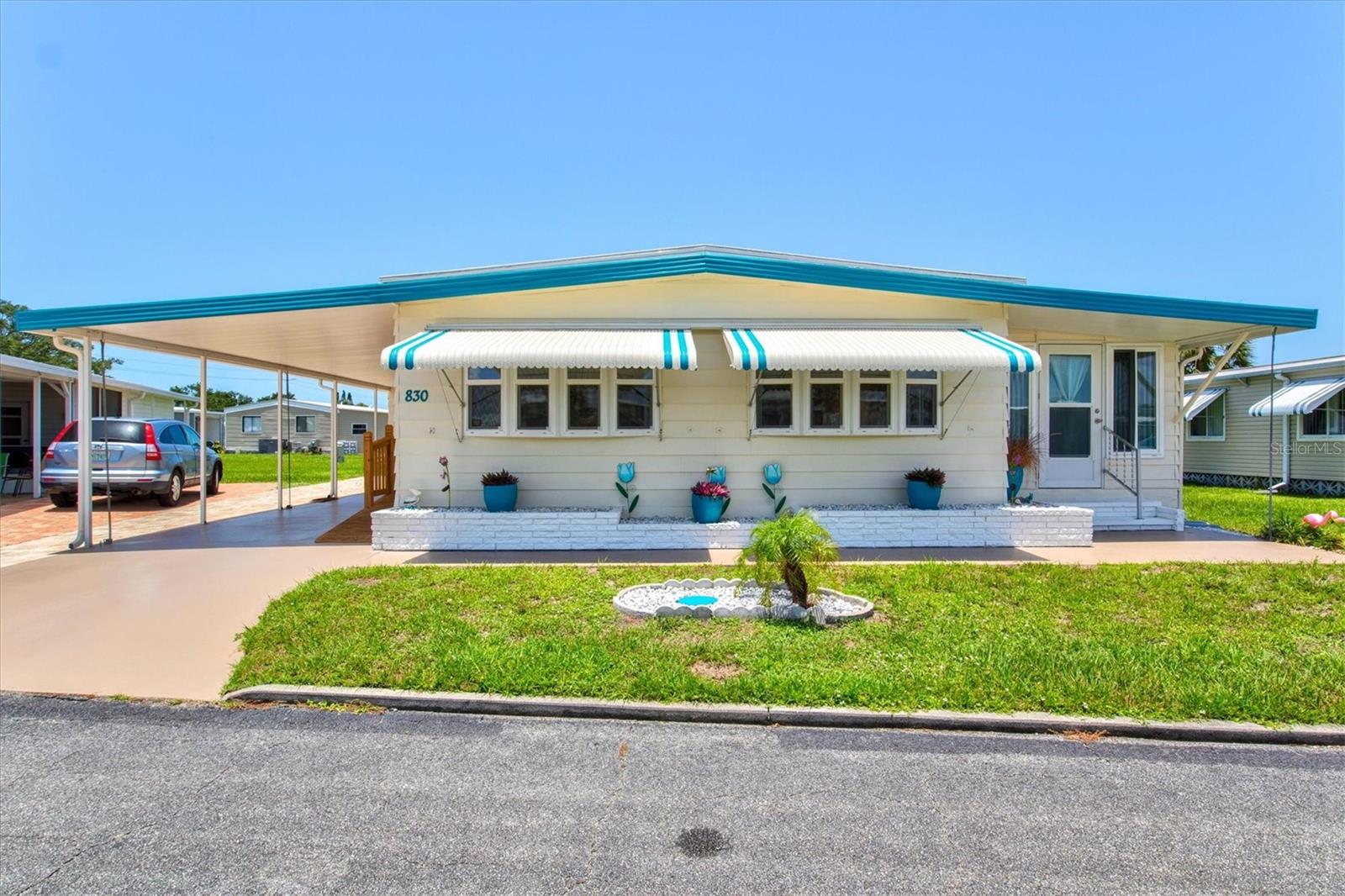 Welcome to your slice of paradise in the sought-after Venice Isle community—a charming, resident-owned 55+ park nestled just minutes from the Gulf Coast’s pristine beaches and Venice’s historic downtown. This delightful 1977 Crit 44’ double wide, 2-bedroom, 2-bath residence is brimming with thoughtful upgrades and pride of ownership. Step inside to discover abundant natural light pouring in through double-pane vinyl insulated low-E windows (2017), highlighting the open layout and new laminate flooring throughout (2017). The spacious sunroom offers the perfect spot for morning coffee or quiet relaxation, while the covered carport and adjacent utility shed with laundry provide ample storage and convenience. Recent improvements include a dishwasher (2025), range, fridge, disposal, washer, dryer, and water heater (all 2017), along with an under-sink water filter (2017). Both bathrooms have been updated with Bathfitter tubs and showers (2017), complemented by window treatments and wired smoke detectors (2017). Structural updates include a roof-over system (2012), and a carport roof upgraded in 2017 with insulation and hurricane straps. Tiedowns and anchors were adjusted and inspected in 2017, with the subfloor, vapor barrier, and insulation replaced the same year. The driveway was freshly painted in 2024, adding to the home’s polished curb appeal. Venice Isle isn’t just a home—it’s a lifestyle. With access to two clubhouses each featuring heated pools, hot tubs, saunas, fitness rooms, billiards, ceramics classrooms (including kilns), tennis courts, shuffleboard, bocce ball, lawn bowling, putting greens, a library, and more, there’s always something engaging to enjoy. Organized activities, a shuttle service, and a friendly, active community spirit define daily life here. Plus, maintenance fees include lawn care, edging, bulk cable, and community upkeep. Conveniently located off US-41, you’re only a short drive from Venice Beach, downtown shops, dining, and cultural attractions. Don’t miss your chance to own this well-maintained gem in one of Venice’s premier communities—schedule your showing today and start living the Florida dream!