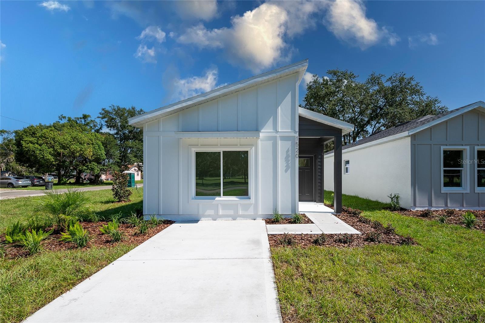 Brand New Build on a Corner Lot in Sanford. This Home is Move-In Ready! Be the first to live in this beautifully constructed 3 bedroom, 2 bath home in the heart of Sanford! This solid block new construction offers peace of mind, modern features, and a low maintenance lifestyle making it perfect for families, professionals, investors or anyone looking for a fresh start. Step inside and enjoy the open layout, luxury vinyl plank flooring, and designer finishes throughout. The kitchen stuns with 42” shaker cabinets, quartz countertops, and plenty of cabinet space, ideal for cooking and entertaining. Retreat to the private primary suite featuring a spacious walk-in closet and elegant bath. Outside, enjoy tropical landscaping, a one-car garage, and a prime corner lot with curb appeal to spare, all with no HOA restrictions. Rest easy knowing your home comes with a builder warranty, new HVAC, plumbing, and electrical, and the efficiency of low maintenance new construction. Just minutes from Sanford’s vibrant town center, shopping, hospitals, and an easy drive to Orlando, this location blends convenience with a growing, up-and-coming community feel. Ready to make it yours? Schedule your private tour today and step into your new home! Be sure to check out the newly built home next door as well!