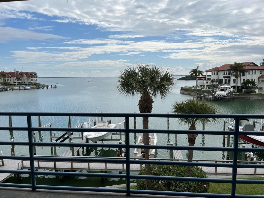 SHORT TERM SEASONAL RENTAL: Jan- Apr $4500 Monthly. OFF Season rate $3300: May-Dec. NOT AVAILABLE: JAN - MAR 2026. Waterfront Rental on beautiful Tierra Verde. Open the door to paradise sweeping bay views from this bright and sunny furnished 2-bedroom/2-bathroom condo at Anchor Cove. Enjoy dolphin watching the spacious balcony overlook the bay. This open floor plan features a large/great room, built-in wet bar and a dining area for entertaining. The modern kitchen includes a stackable washer/dryer and breakfast bar. The large primary bedroom has a picturesque water view and en suite bathroom including a walk-in shower and large walk-in closet. The guest bathroom features (2) twin beds. Sunbathe or relax poolside, or head to the newly finished courts for a game of pickleball. Amenities include car wash, covered tandem parking and convenient elevator. Located approximately 3 miles from the Fort DeSoto State Park, 10 minutes or less to the Gulf Beaches, easy access to I-275 and approximately 15 minutes  to downtown St. Petersburg. 30-day minimum rental. Security deposit ($600) and condo application fee ($100) are required. 13% sales tax applies. No Pets. Call for availability and more details.