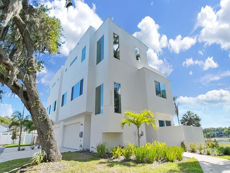 Welcome to luxury living just minutes from the heart of Downtown Tampa. Situated in the highly desirable Riverside Heights neighborhood, this contemporary 3-bedroom, 3-bathroom townhome combines sleek modern design with the tranquility of waterfront living. From the moment you walk in, you'll be drawn to the open-concept floor plan, filled with natural light and thoughtfully designed for both relaxation and entertaining. The kitchen is a true showpiece, featuring quartz countertops, gas stove, high-end stainless steel appliances, custom cabinetry, and a spacious island that seamlessly connects to the living and dining areas. Step outside onto your private deck and take in breathtaking, unobstructed views of the Hillsborough River — the perfect backdrop for your morning coffee or evening unwind. Each of the three bedrooms offers generous space, stylish finishes, and spa-like en-suite bathrooms. The primary suite is a serene retreat, complete with a large walk-in closet, dual vanities, and a sleek glass-enclosed shower. Throughout the home, luxury flooring and high ceilings enhance the clean, modern aesthetic, while smart home features and energy-efficient systems add convenience and sustainability. With an attached garage and low-maintenance living in a quiet, upscale community, this home provides the perfect balance of peace and proximity. You're just minutes from Armature Works, the Tampa Riverwalk, Water Street, and some of the city’s best dining, shopping, and entertainment options. Don’t miss your chance to own a modern townhome with riverfront charm in one of Tampa’s most vibrant and fast-growing neighborhoods. Schedule your private showing today.