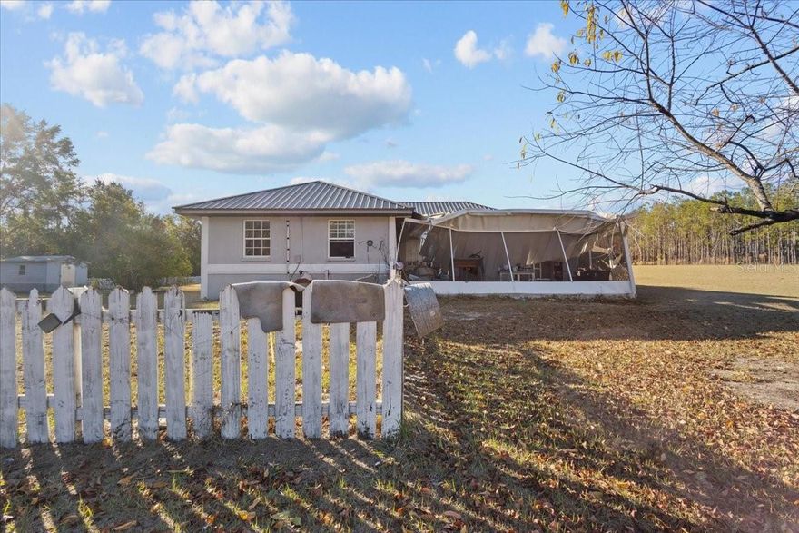 Welcome to gorgeous Suwannee County. This concrete block home is very very spacious at over 2000 square feet heated and cooled, 3 bedrooms/2 bathroom and bonus room converted from garage. All perfectly placed on 10 acres of open land to make it your own! Floor plan is nice and open with ceramic tile floors throughout , spacious living room with open kitchen , laundry room right off the kitchen for ease access while cooking and cleaning. Split floor plan with guest bedrooms and bathroom on one side then master and master bathroom on the other. This home also has a in ground pool . Front patio covering damaged during a summer storm this year, accepting cash only! Call today for YOUR tour!