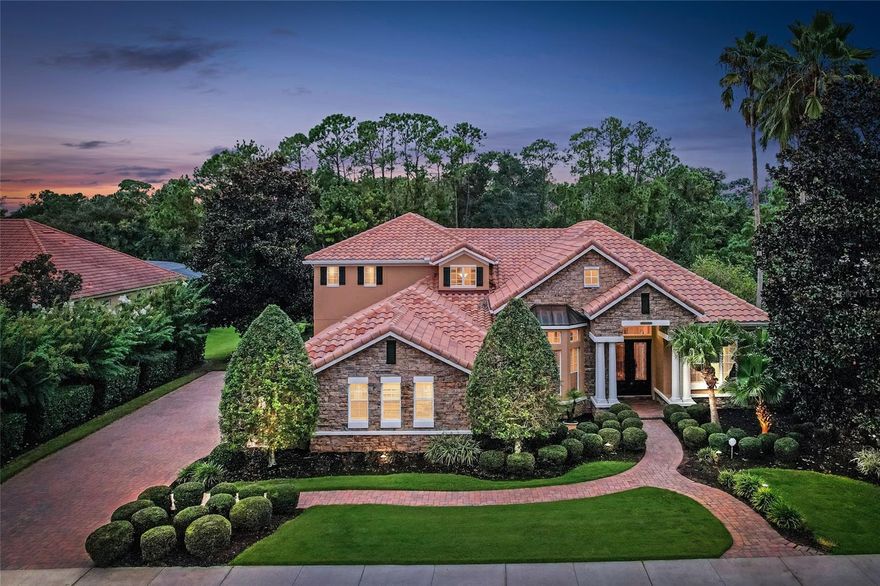 This Parade of Homes Winner at 130 Osprey Hammock Trail is one of the crown jewels of the gated Estates at Wekiva Park. Backing to a protected preserve, the home offers unmatched privacy and a serene setting where deer and wildlife are frequent visitors. Beyond the preserve, Wilson’s Landing Park provides trails, river access, and open space perfect for walking dogs, launching kayaks, or daily exercise. Inside, you’ll find engineered wood floors, soaring tray ceilings, custom lighting, and surround sound throughout. The gourmet kitchen boasts GE Monogram appliances, gas stove, double ovens, warming drawer, dual sinks with disposals, butcher block island with prep sink, walk-in pantry, and butler’s pantry. The owner’s suite features custom closets, Jacuzzi tub, and a walk-in shower with eight shower heads. Upstairs offers two bedrooms, a large bonus/game room with full kitchen, and a theater room. Additional highlights include a 3-car garage, dual staircases, office with built-ins, and oversized storage closets. Outdoors, enjoy a heated pool and spa, summer kitchen with grill and fridge, and a barrel tile roof. Conveniently located near SR 429, SR 417, and I-4 for shopping, dining, and entertainment.