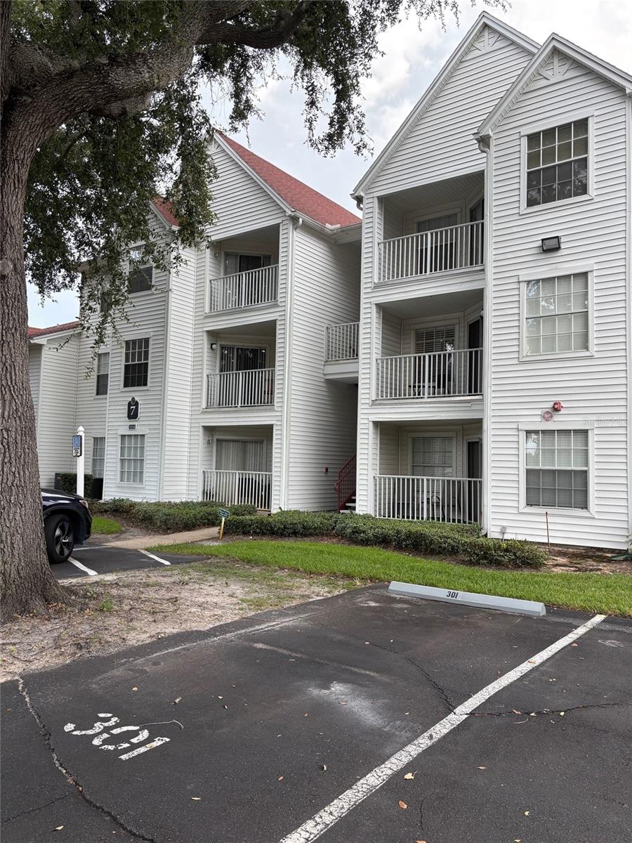 Enjoy your charming 1 BD / 1 BA condominium with a rear patio overlooking the tennis courts, all set within the desirable, gated community of Lexington Place! You will feel like you are on vacation all year long. You walk into a large family room with vaulted ceilings and wood look tile flooring. Large windows let in lots of natural light giving this a spacious feel. Your galley kitchen has granite countertops with a bar top, stainless steel appliances and a full-size washer and dryer. Your private owner’s suite has a walk-in closet with lots of storage space. The bath has an updated vanity, granite tops and tiled floors.This community offers many amenities including resort-style clubhouse with HOA on site, large community pool and spa, fitness center, indoor racquetball court, tennis court, playground, and more. HOA dues also include water, exterior maintenance, lawn, pest control. Excellent location just minutes from Disney, Universal, SeaWorld, the Convention Center, International Drive. This will not last long.