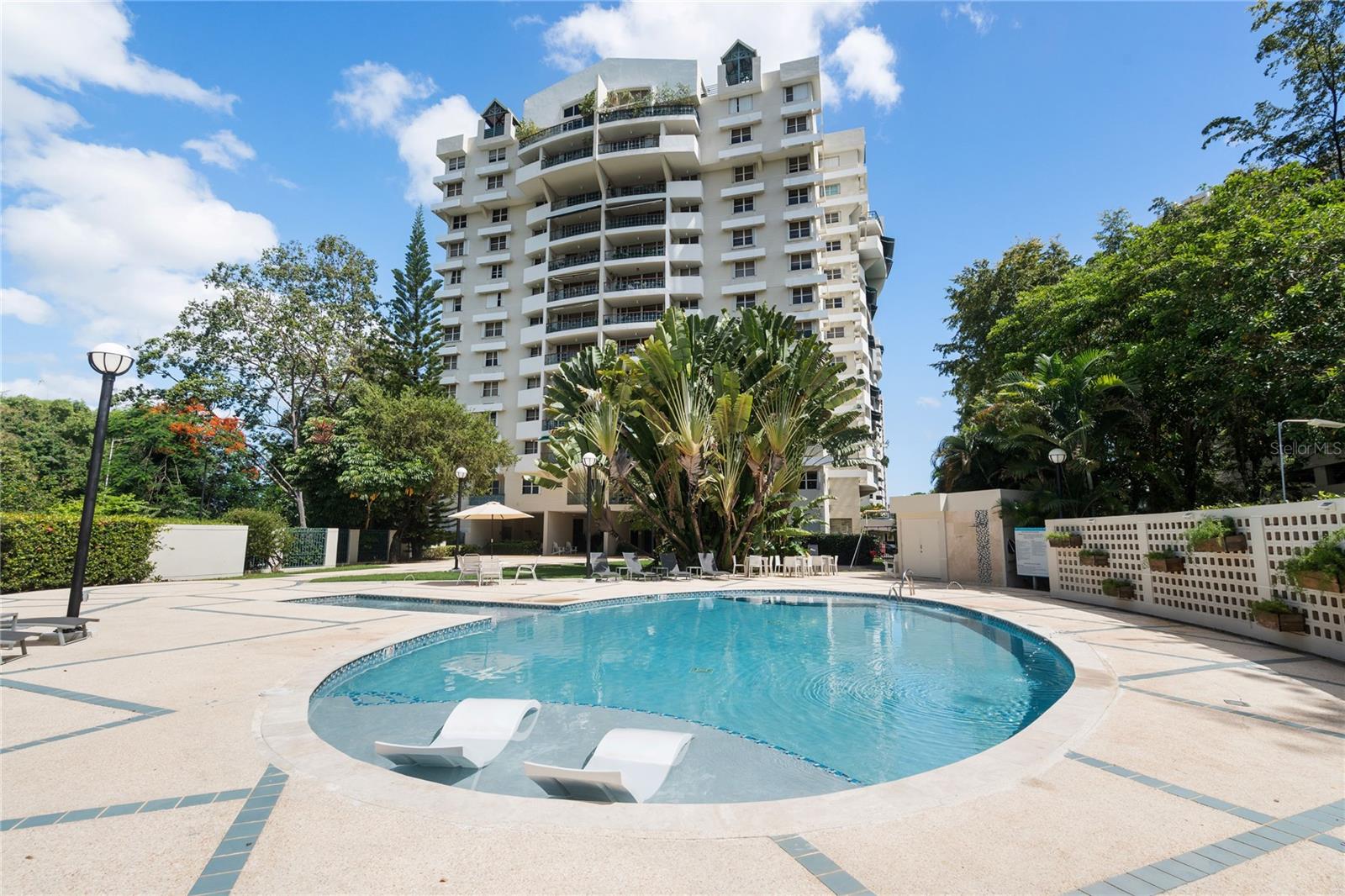 Discover the perfect balance of comfort, space, and location in this elegant penthouse at Parque de Loyola, nestled in one of San Juan’s most established residential communities. With expansive interiors, high ceilings, and large windows throughout, this top-floor residence offers a light-filled sanctuary with sweeping views of the city skyline and lush greenery. Its private and peaceful setting makes it ideal for families or professionals seeking serenity without sacrificing convenience.
This well-appointed penthouse features three spacious bedrooms, including a primary suite with an en-suite bathroom and ample closet space. The open-concept living and dining areas flow seamlessly into a fully equipped kitchen with modern appliances and custom cabinetry. A private terrace offers the ideal setting for al fresco dining, entertaining, or simply enjoying San Juan’s tropical breezes and stunning sunsets.
Parque de Loyola is a gated, family-friendly community offering controlled access, 24/7 security, and recreational amenities such as tennis courts, walking paths, and playgrounds. Ideally located near the University of Puerto Rico, hospitals, shopping centers, major highways, and just a short drive to the beach, this penthouse is a rare find—offering both lifestyle and value in the heart of San Juan.