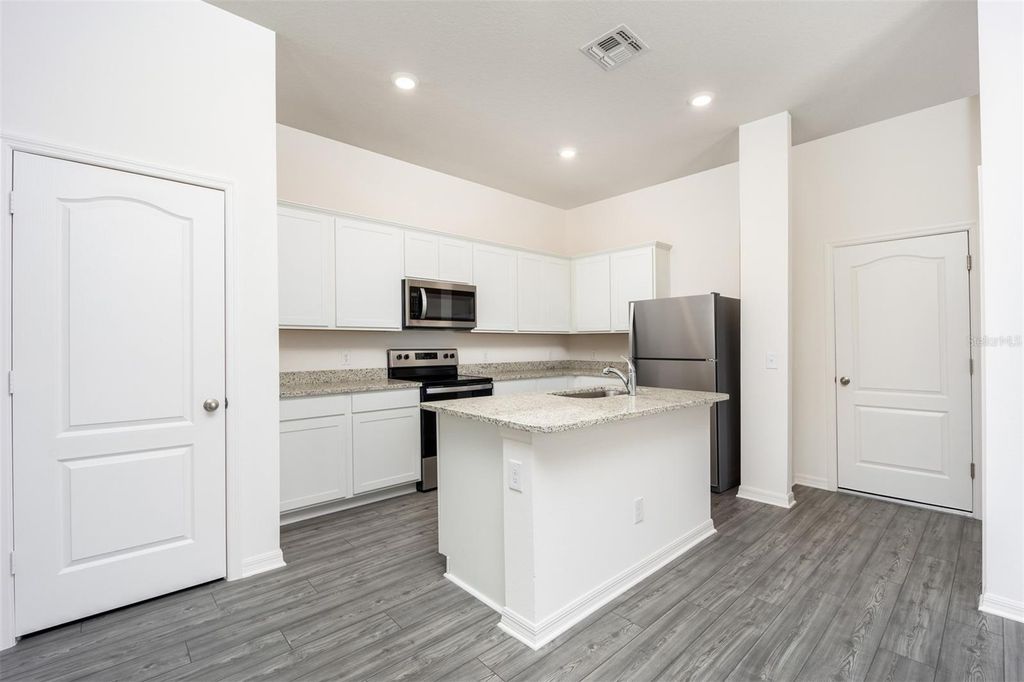 Photo of 854 Poppy Lane, Dundee, FL 33838 (MLS # TB8434438)