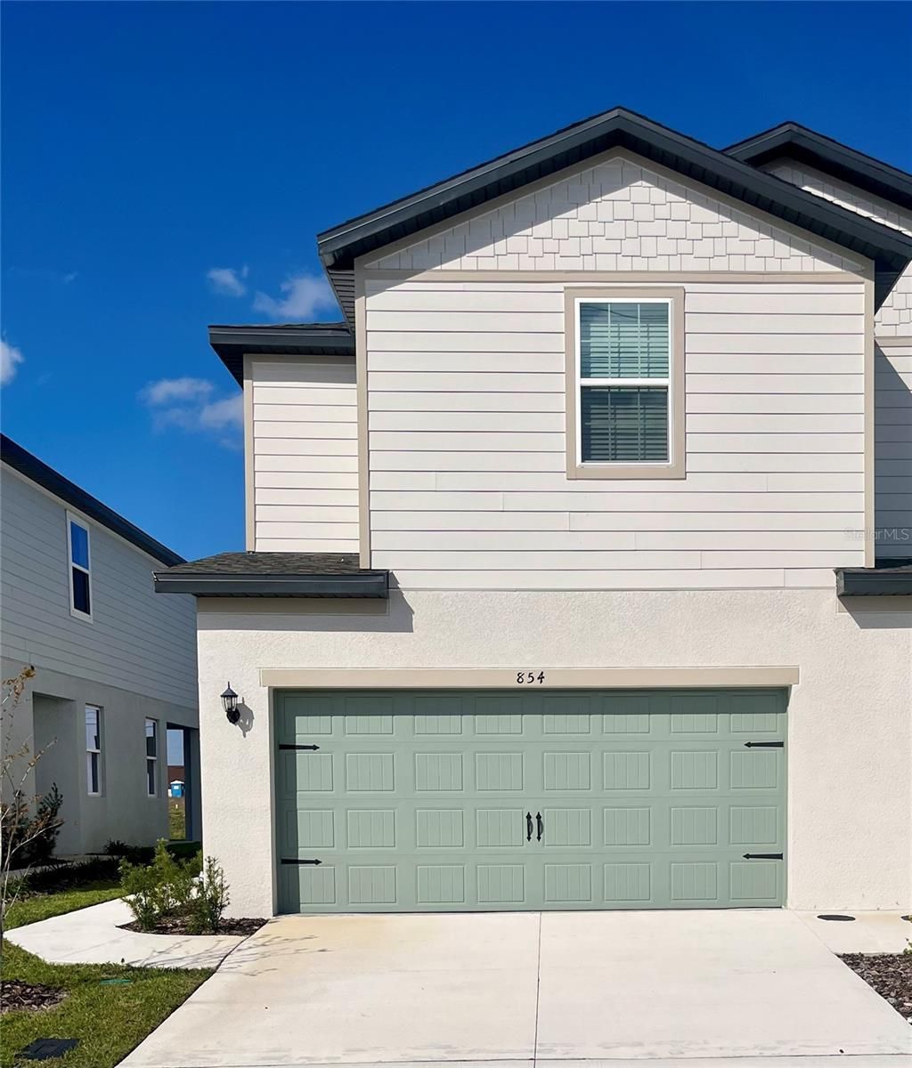 Photo of 854 Poppy Lane, Dundee, FL 33838 (MLS # TB8434438)
