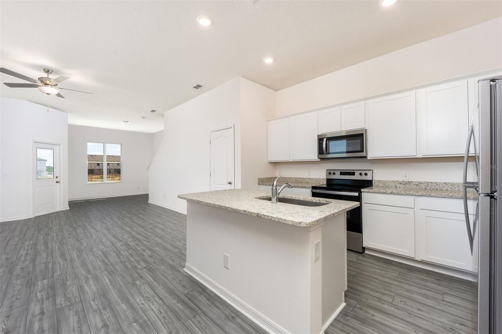 Photo of 854 Poppy Lane, Dundee, FL 33838 (MLS # TB8434438)