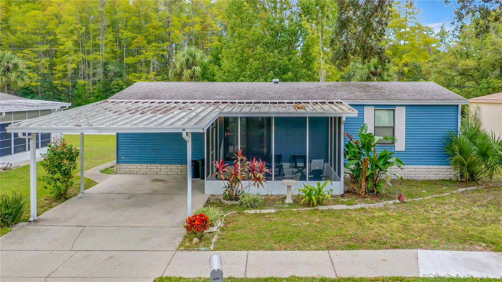 A POPULAR 55+ COMMUNITY WHICH HAS A POOL, CLUBHOUSE, & ACTIVITIES FOR ONLY $74 MONTH (HOA FEE). The price reflects the property needs a new roof, a new a/c heat unit, and outside electric panel needs replaced and updated to the new codes. The property also has a flex place which can be used as a family room/den/ office/ or a 3rd bedroom. Kitchen is open and bright with a breakfast bar, a food pantry and a laundry area off the kitchen. A large covered, screened in Lanai for enjoying the Florida weather, and a covered 14X19 carport. Great open layout. Pets are welcome, which it's hard to find a HOA that accepts 2 pets! Location is convenient to Shopping, restaurants, Sun West Beach, Hernando Beach, Weeki Wachee, Spring Hill, Hudson Beach, medical, and Tampa International airport around 50 minutes.