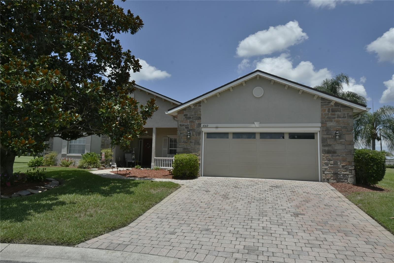 This unique alternate front elevation TAHITI floor plan home is located on a pie shaped oversides pond and golf course frontage lot.