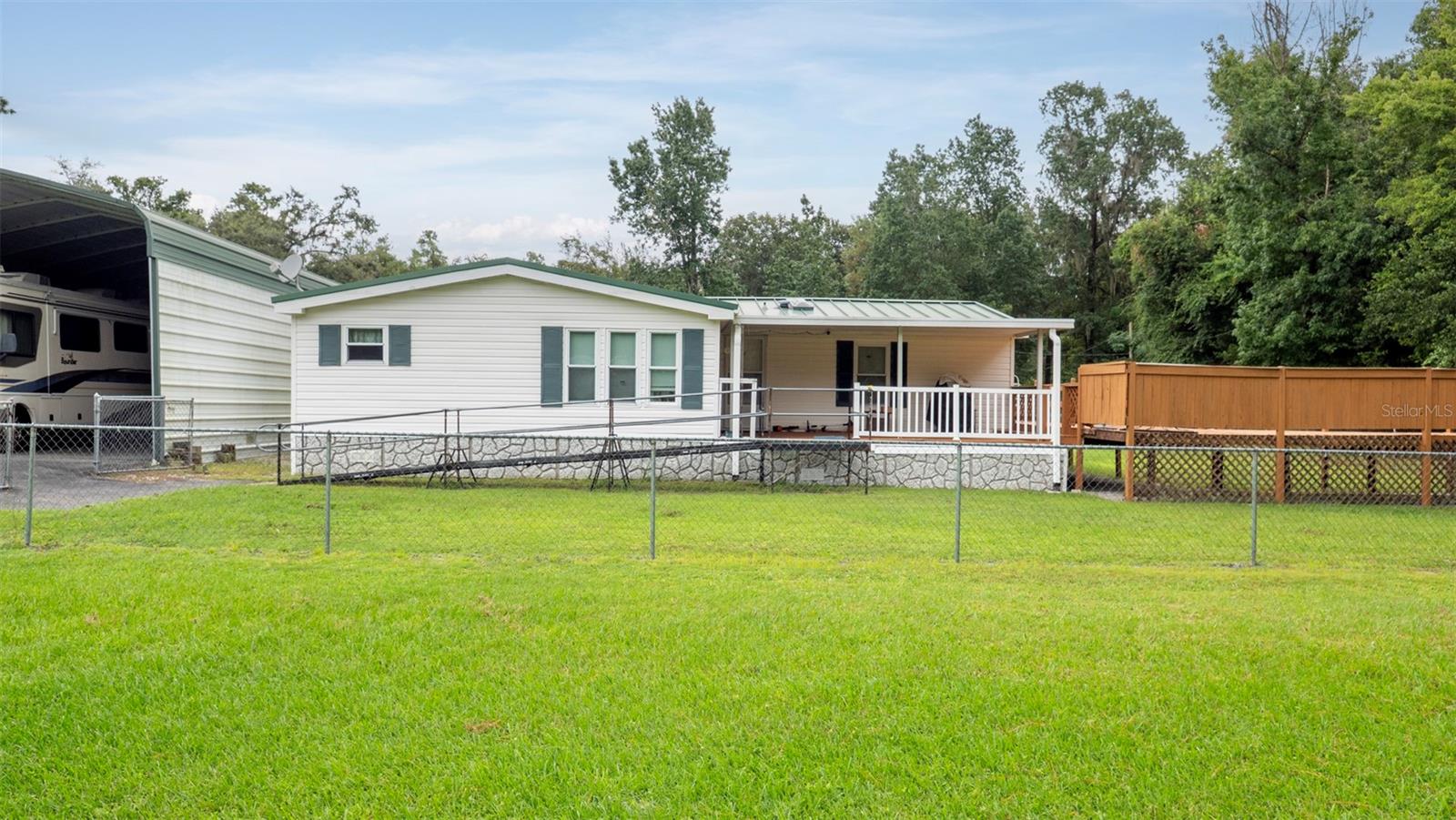 Welcome to your dream home in beautiful Brooksville, FL! This stunning manufactured home boasts 3 bedrooms and 2 bathrooms, perfect for a growing family or those looking for extra space. With 1440 living square feet, and energy efficient windows added in 2009 there is plenty of room to entertain and relax. The home features a spacious 40x22 carport, providing ample parking for multiple vehicles. Need extra storage? No problem! There is a 30ft shed on the property, perfect for storing all of your outdoor equipment and tools. The metal roof adds a touch of charm and durability to this already impressive property. Located in a peaceful and friendly neighborhood, you'll love the serene surroundings and sense of community. Don't miss your chance to make this house your forever home. Schedule a showing today!