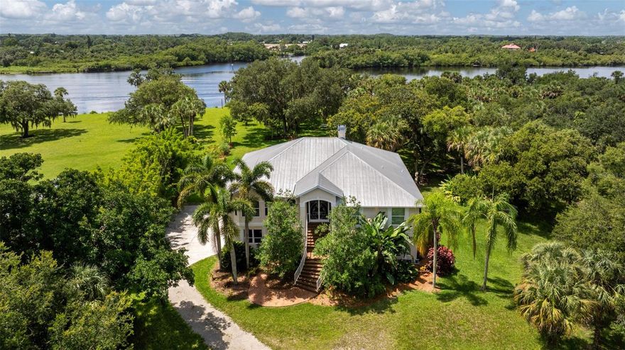 Experience the Best of Old Florida Living! Nestled along the serene banks of the Caloosahatchee, this breathtaking waterfront estate captures the essence of tranquility and timeless Florida charm. Situated on one of the most sought-after and exclusive roads in all of Southwest Florida, this 3-bedroom, 3-bathroom home spans nearly 4,000 square feet and rests on almost 3 acres of beautifully landscaped grounds. This property has never flooded, sitting high and dry at almost 12 feet of elevation! The property features a pool & spa with an expansive lanai, a private pond, a boat dock with a lift, an outdoor elevator, a variety of fruit trees under a canopy of mature Oaks, impact windows, a screened in deck, and so much more. The interior is equally as impressive, with an open Florida style floor-plan, allowing views of the river from almost any spot in the house. Every aspect of this house and property has been thoughtfully designed with the old Florida lifestyle in mind, where the interior and exterior flow into one, connecting you to the amazing landscape and nature Alva has to offer. Despite the peaceful seclusion, you're never far from modern conveniences. Babcock Ranch is just 10 minutes away, I-75 is 15 minutes out, and downtown Fort Myers can be reached in just 25 minutes. Plus, with several local restaurants accessible by boat, your waterfront lifestyle is as convenient as it is scenic. This is a rare opportunity to own one of the last true pieces of authentic Florida—where the connection to nature, water, and peace is unmatched. Boat (2023) and Golf Cart may be conveyed with the property as part of an acceptable offer.