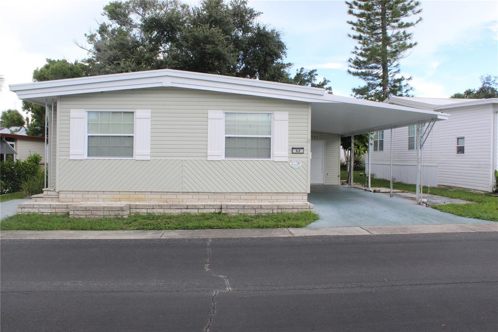 Photo of 52 Royal Palm Circle, Largo, FL 33778 (MLS # TB8550522)