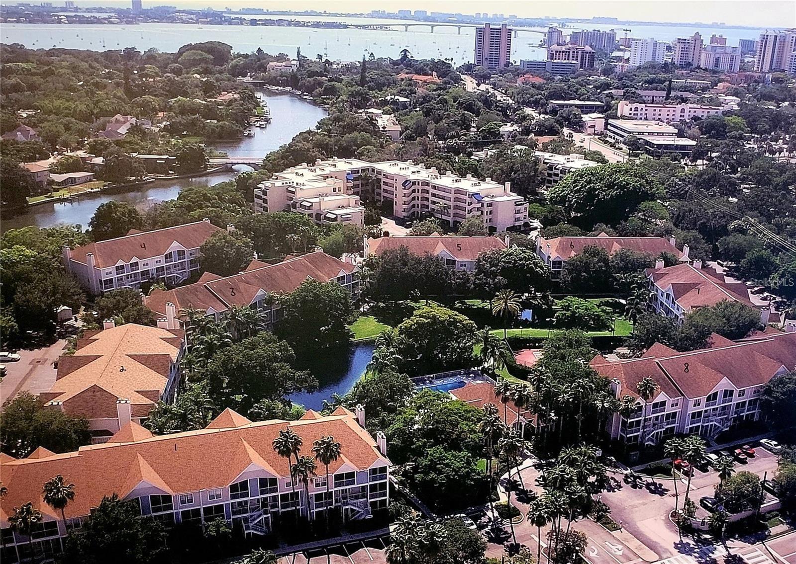 One or more photo(s) has been virtually staged. Corner Downtown Sarasota Condo in Central Park II. Rent includes, Internet, cable, water, sewer and garbage collection. This unit has a bright, open layout and plenty of updates. Abundant natural light and peaceful pond views from two screened porches one each on the second and third floors. Inside, you'll find a welcoming living room with a fireplace, a dining area and a newly updated kitchen featuring brand-new appliances, including a refrigerator, stove, oven, dishwasher, garbage disposal and water heater. The upstairs bedroom offers a private screened porch, a full bathroom with dual access and a washer and dryer. The bedroom has also been updated with luxury vinyl planking for a fresh, modern look. Central Park offers community amenities, including heated pool and spa, a lighted tennis court, a gym and clubhouse. Additionally, there's a private dock where you can launch your kayak or simply enjoy the beautiful sunset with the manatees. As well, there is bike storage, kayak storage, and plenty of parking for convenience. The location couldn't be better. Publix is just across the street for quick grocery trips; and the Bayfront, Selby Gardens, and downtown restaurants and nightlife are all just minutes away. For beach days and shopping, Sarasota's beautiful beaches and St. Armands Circle are only a 10-minute drive. With just one previous owner and having been mostly occupied only during the winter months, this condo has been well cared for and is in great condition,