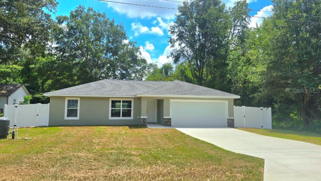 One or more photo(s) has been virtually staged. Welcome home! Back yard is FULLY fenced. This brand-new construction is situated in the highly sought-after Belleview Heights Estates, 5 lots from a paved road. Conveniently located between Ocala and The Villages with very close commute to 484. Builder warranty included! Featuring attractive colors throughout, vinyl plank flooring in every room, and beautiful granite countertops. This home is COMPLETE and ready for you to start your new chapter and experience the Florida lifestyle! Home is move in ready!!