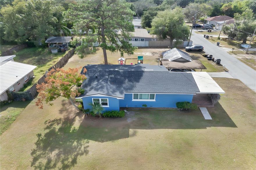 Discover this beautifully renovated 2-bedroom, 1-bath block home on a spacious .25-acre lot. Enjoy an oversized living room filled with natural light from new windows and stylish new flooring throughout. The modern bathroom features contemporary finishes, and the covered brick patio is perfect for outdoor relaxation. Additional perks include a detached carport and a workshop for all your storage and project needs. Don’t miss this charming home that blends comfort and style! Roof - 2023 HVAC- 2005 Water Heater- 2009 Septic was pumped in September 2025. A 75 inch TV will convey with the property as well!!!